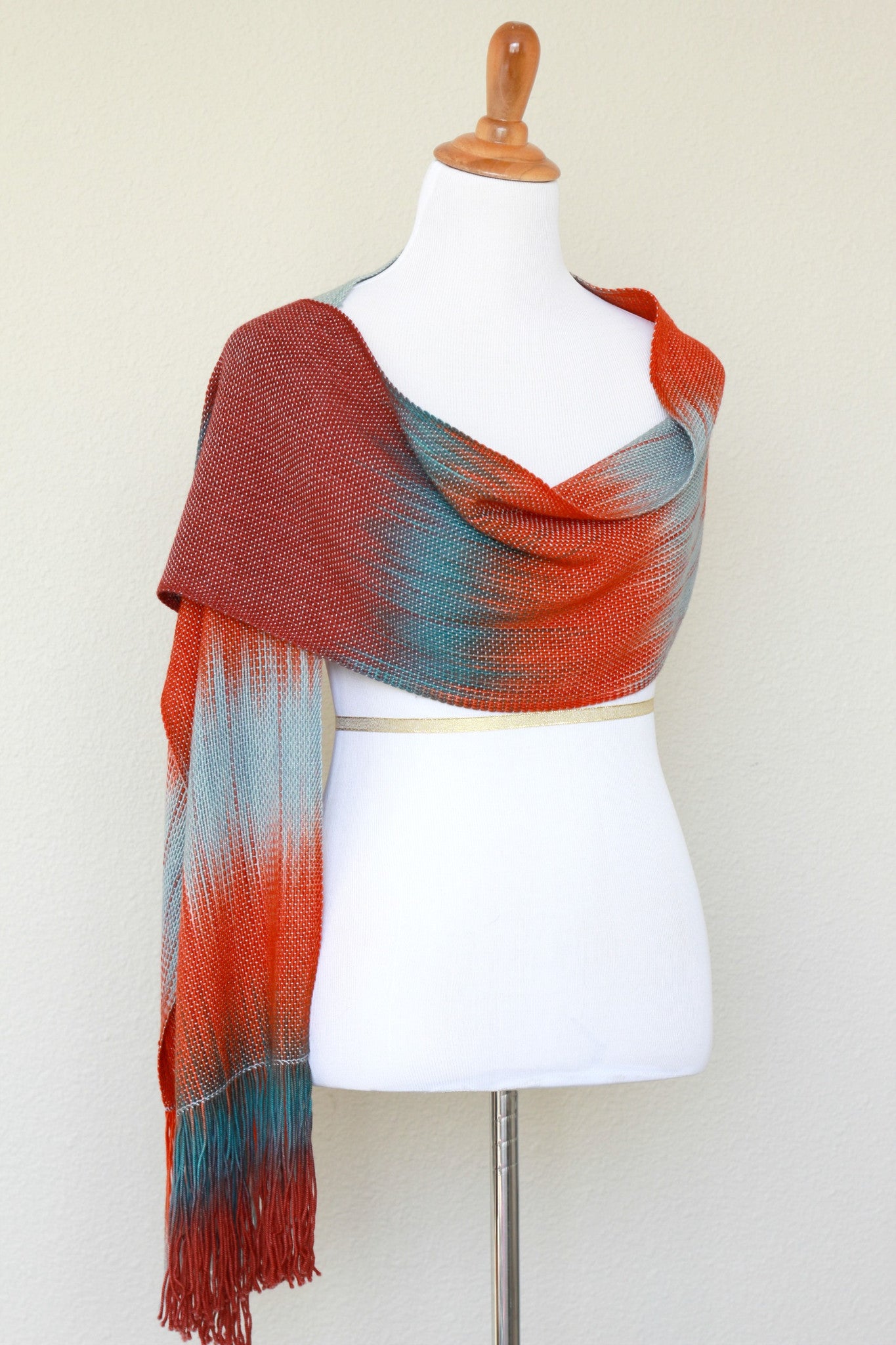 Woven scarf in blue grey, red and teal colors