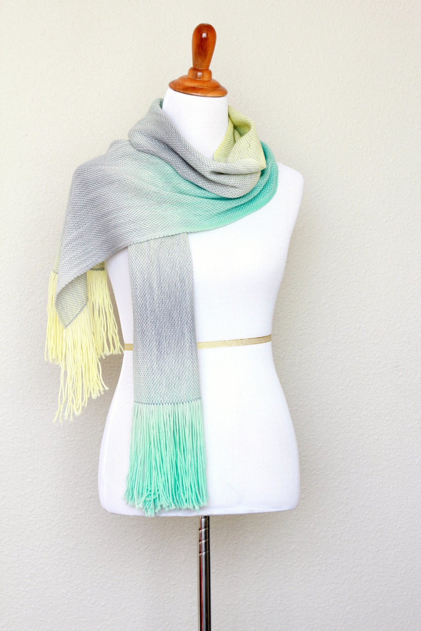 Woven scarf in yellow, green and grey colors