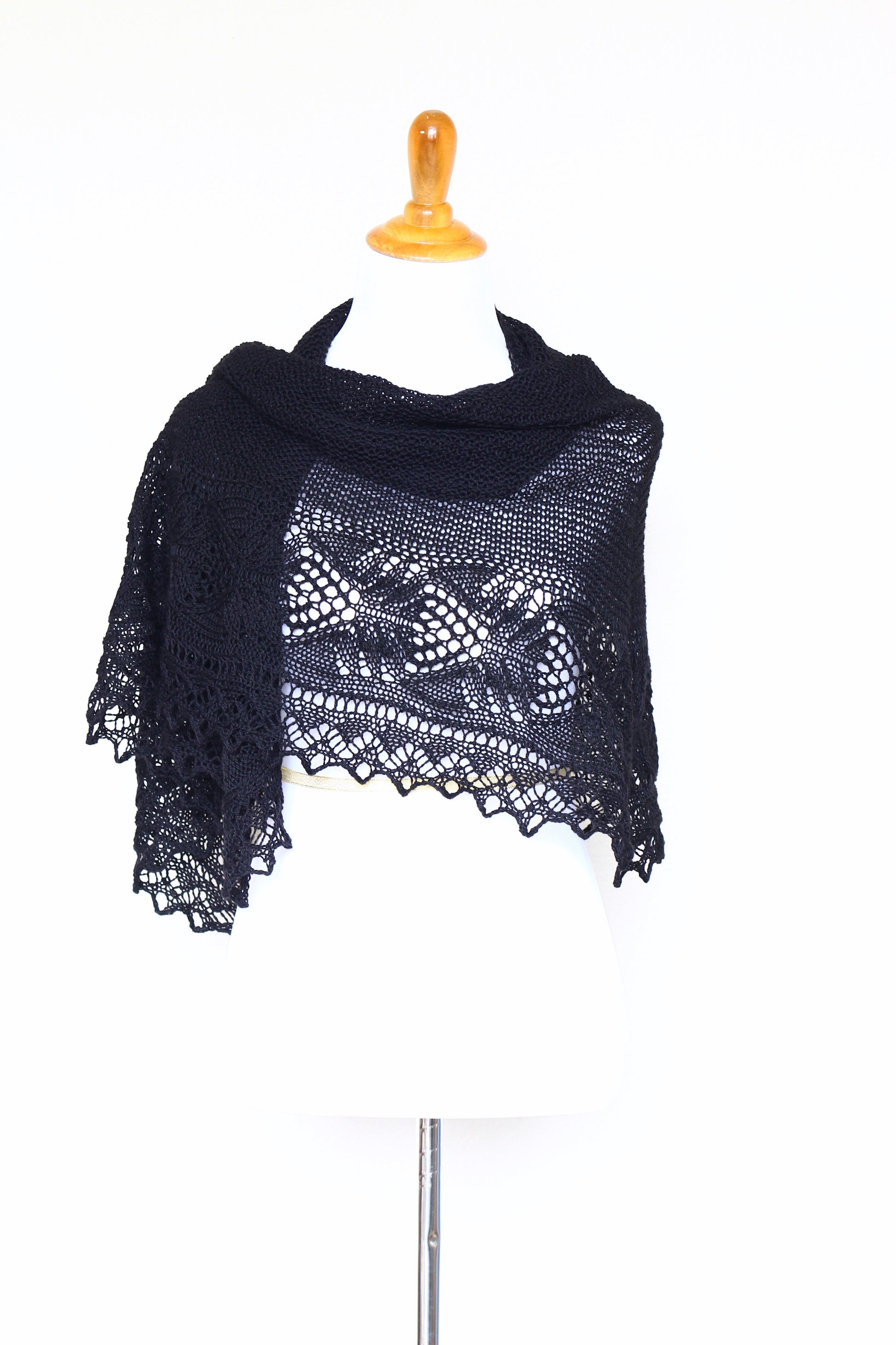 Knit shawl with laced border in black color