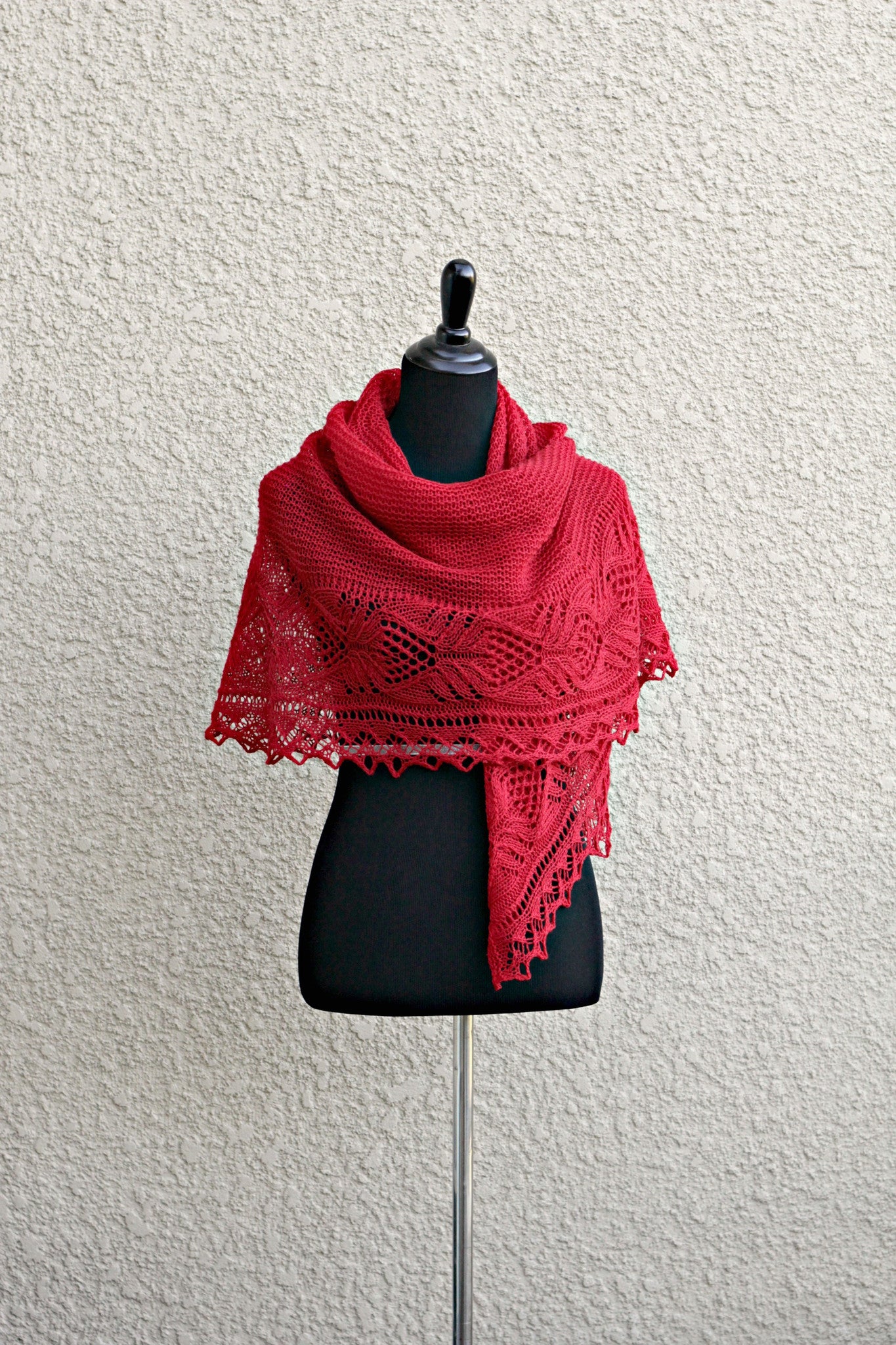 Knit shawl with laced border in red color