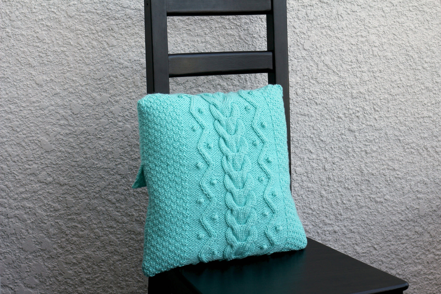 Knit cabled pillow cover with nupps for home decor