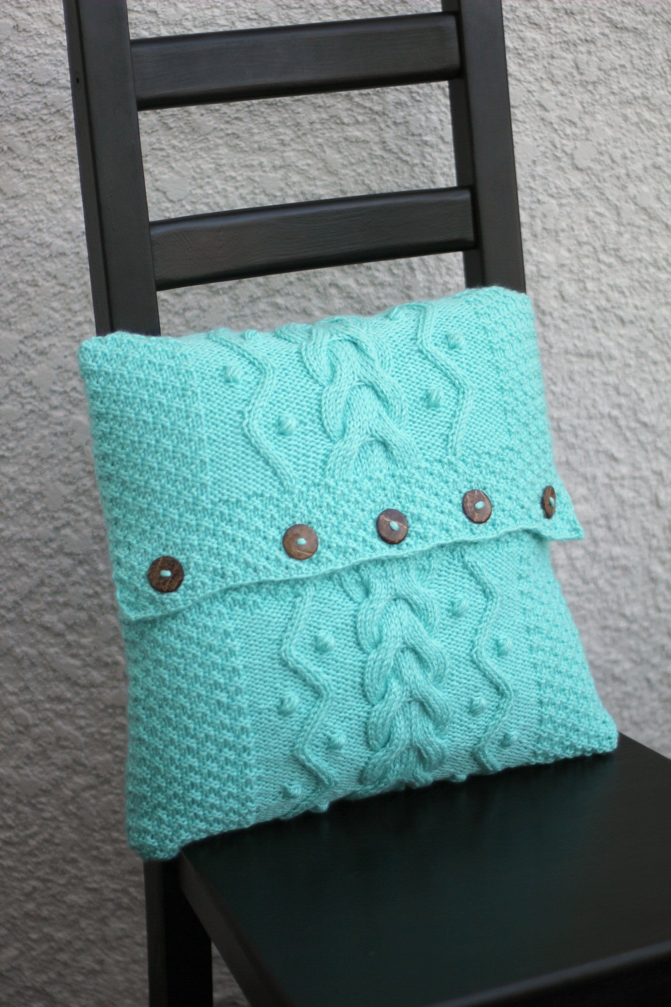 Knit cabled pillow cover with nupps for home decor