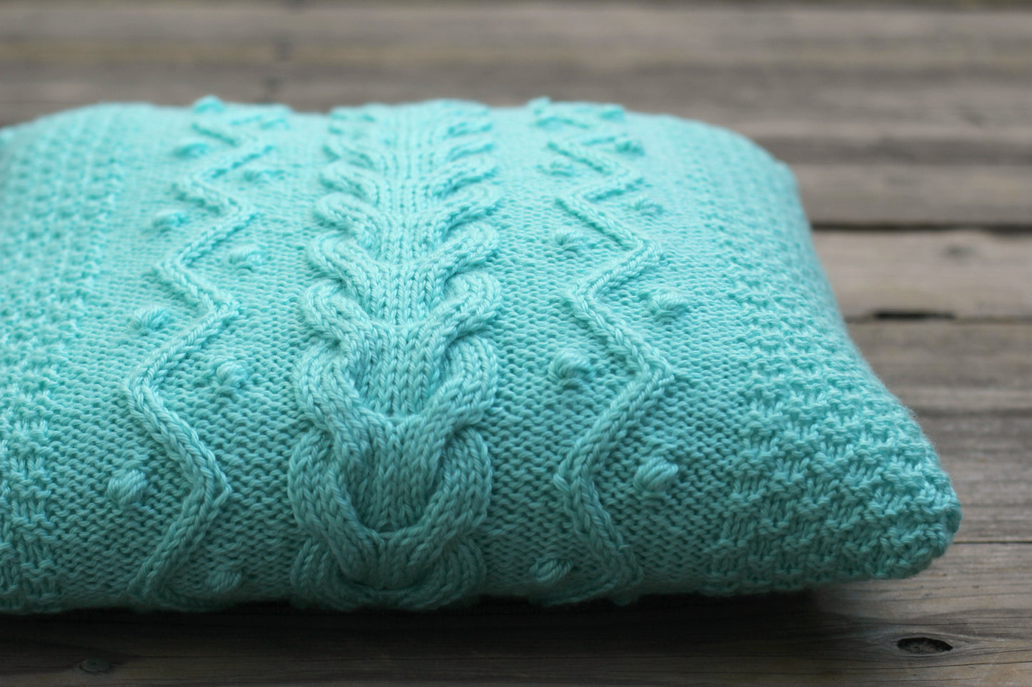 Knit cabled pillow cover with nupps for home decor