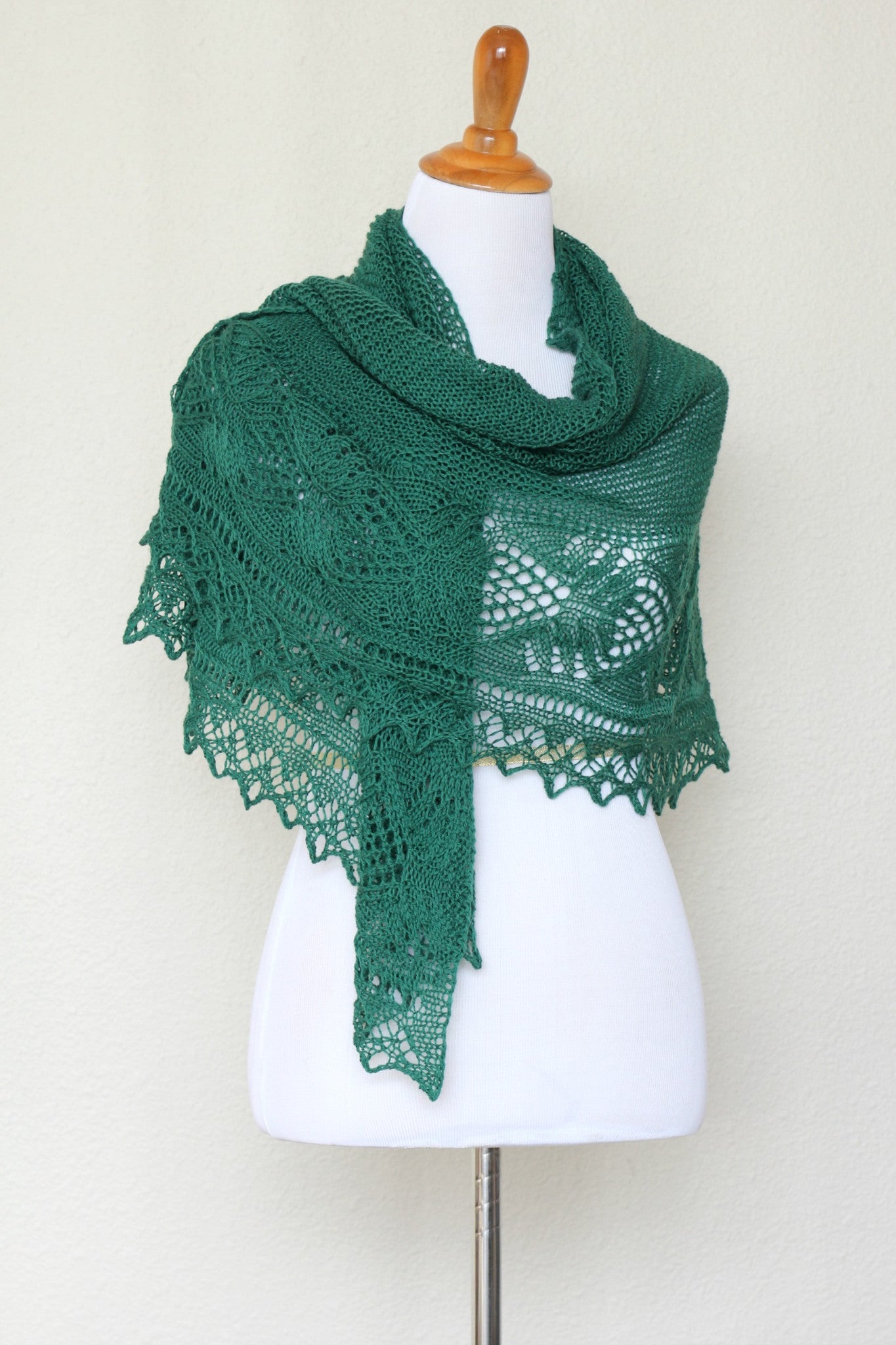Knit shawl with laced border in forest green color