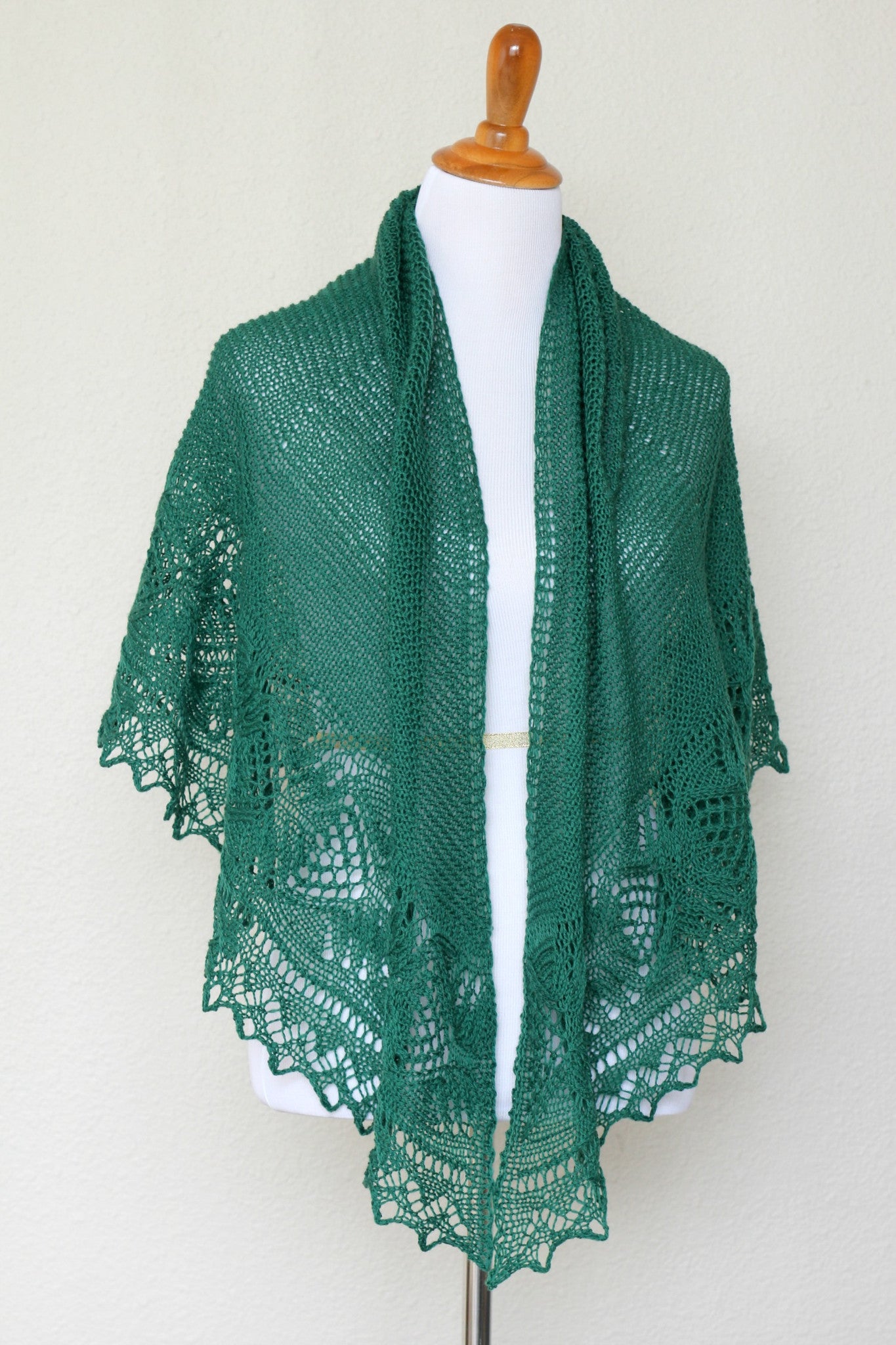 Knit shawl with laced border in forest green color