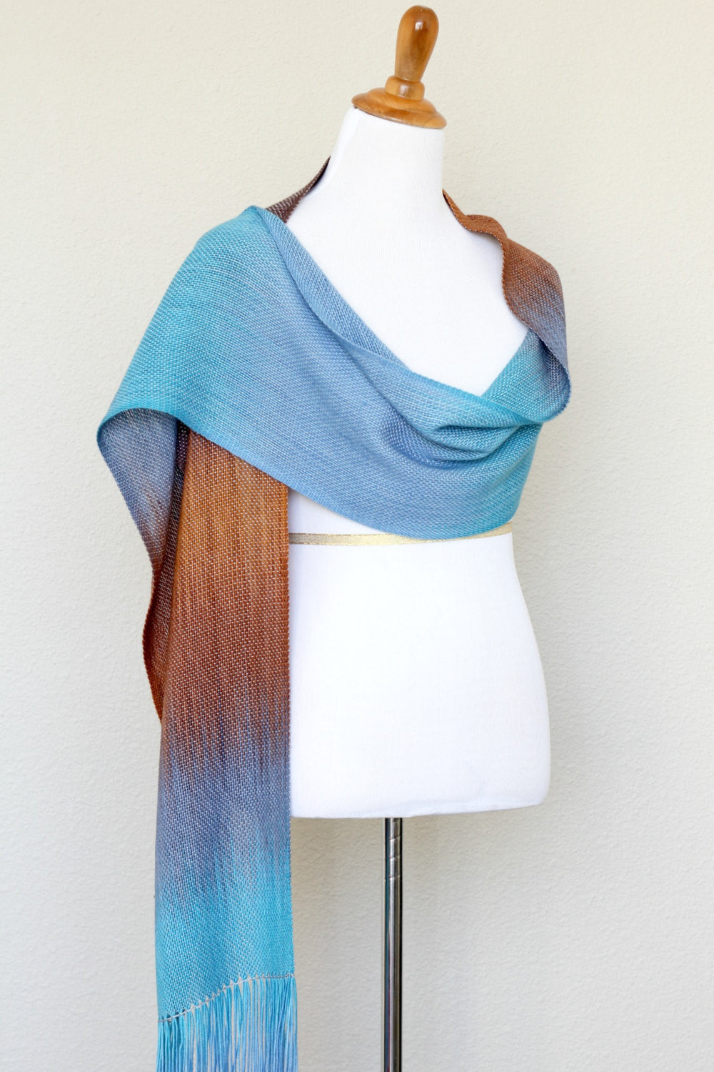 Woven scarf in turquoise, blue and brown colors