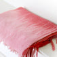 Hand woven scarf in red and pink shades