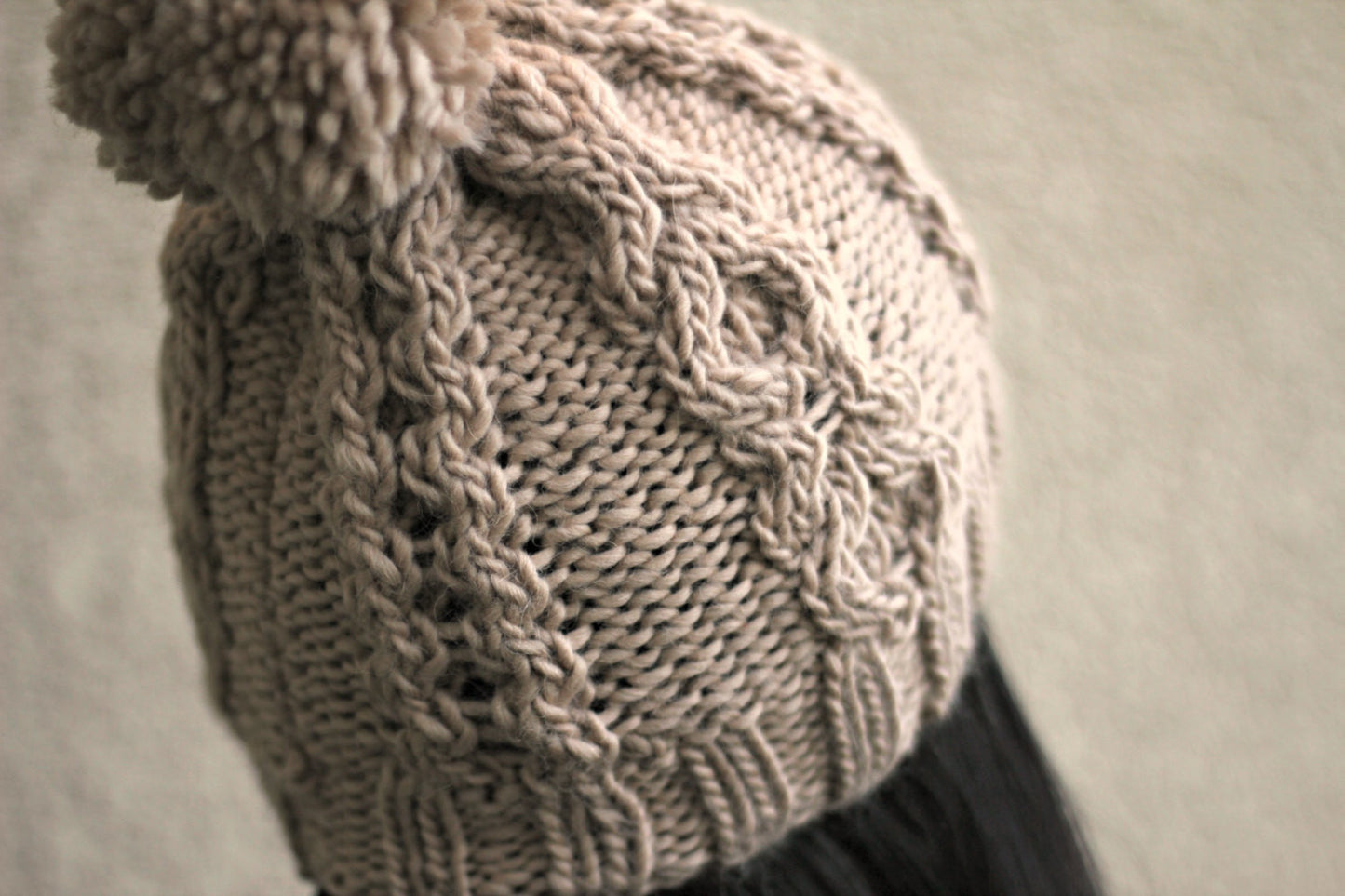 Knitted hat with cables
