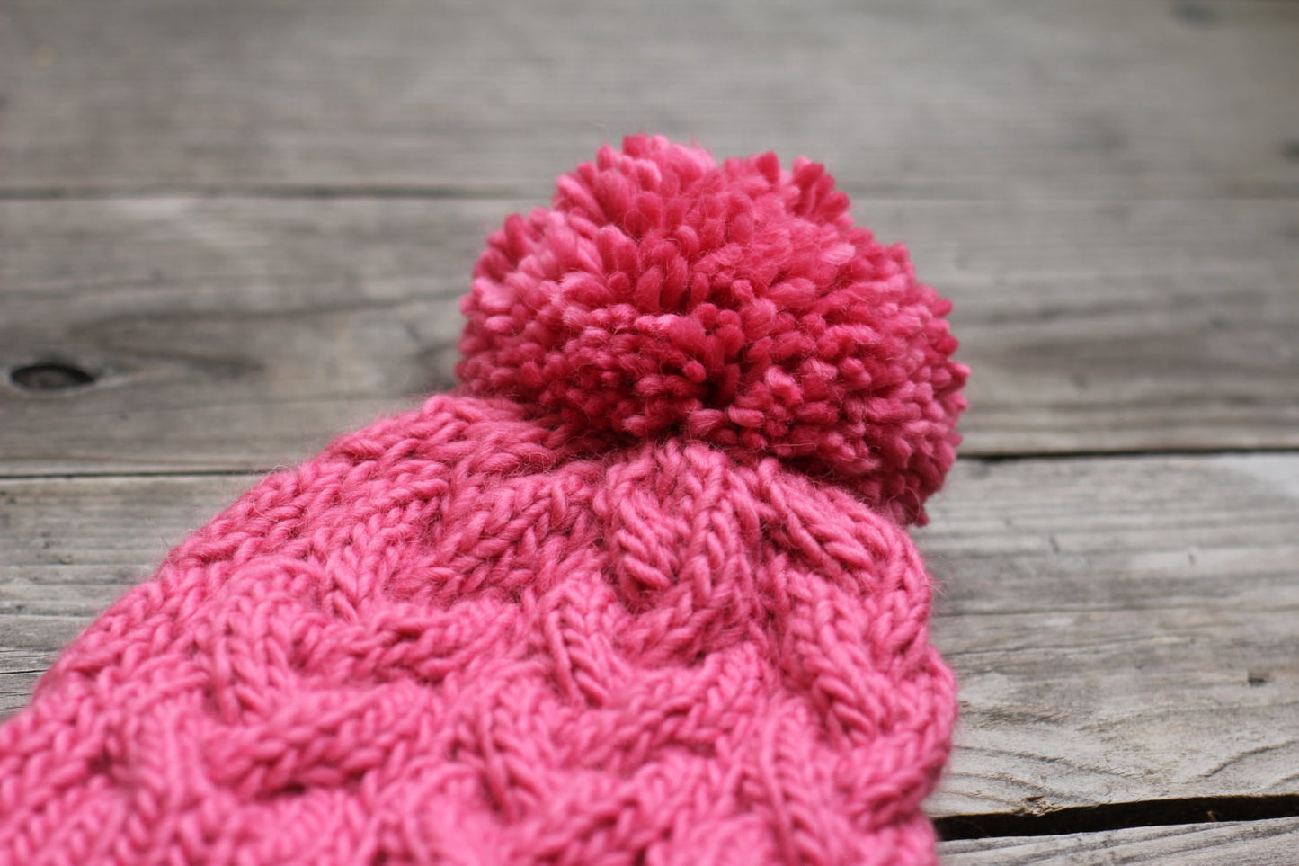 Knitted hat with pom pom