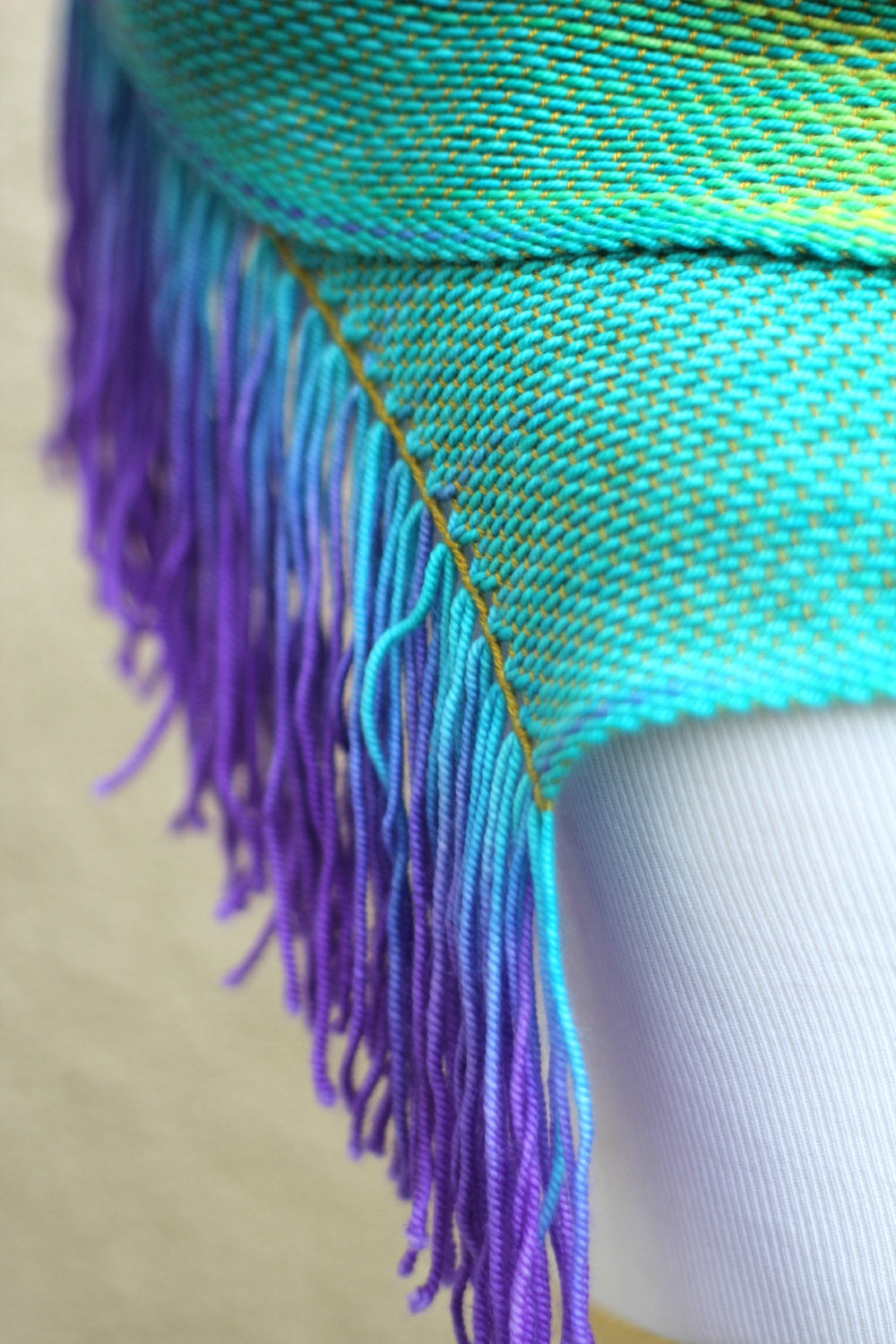 Woven rainbow scarf in red, green, yellow, turquoise and purple