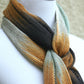 Hand woven scarf in white, orange, black and mint colors