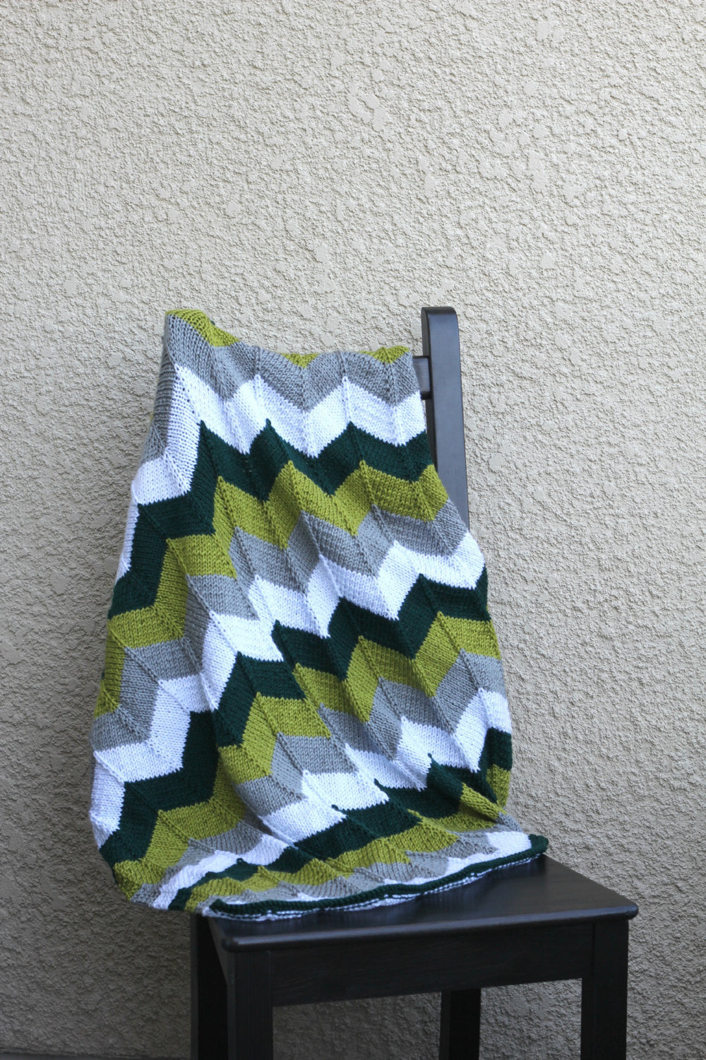 Green and grey baby blanket