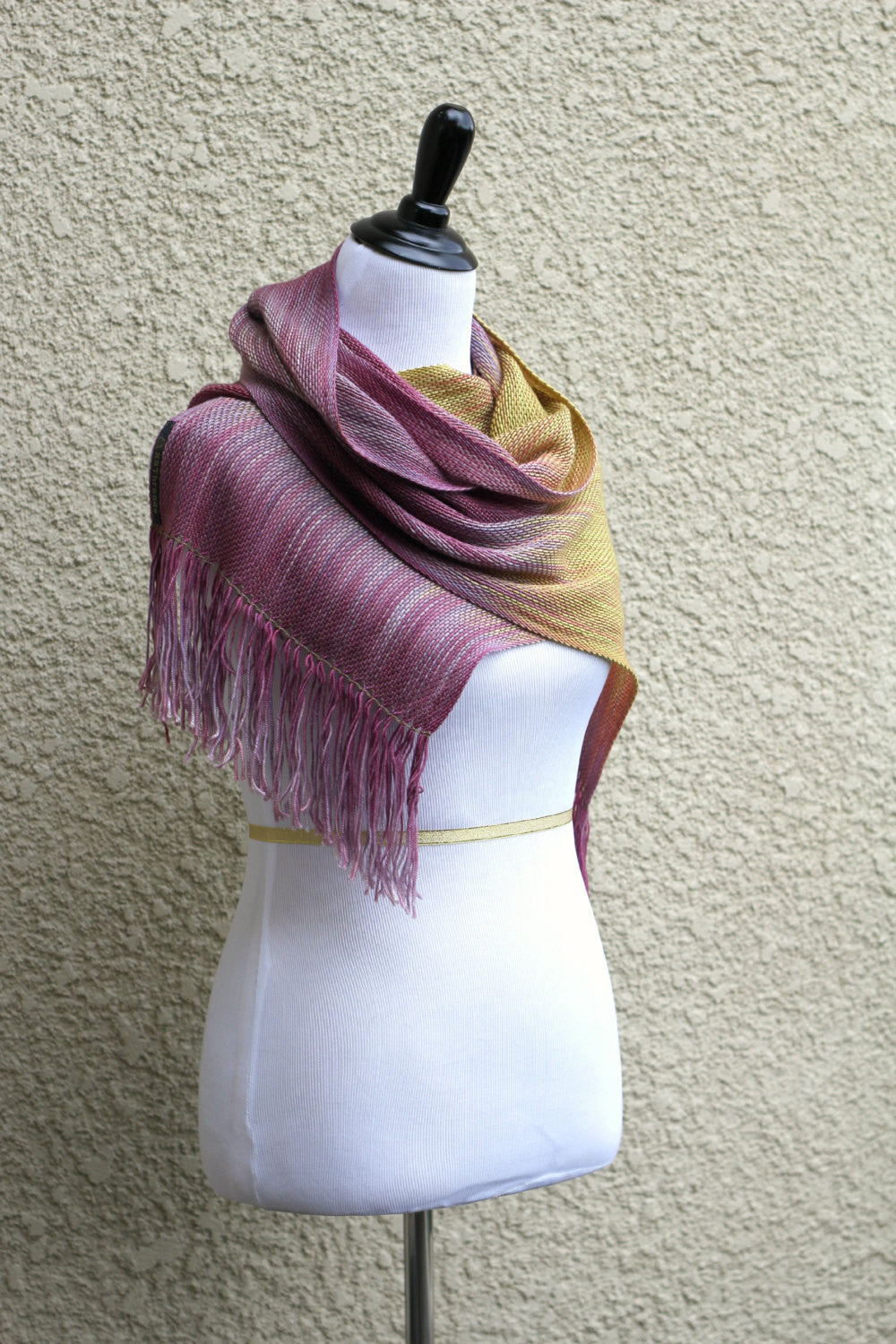 Pink and yellow woven scarf