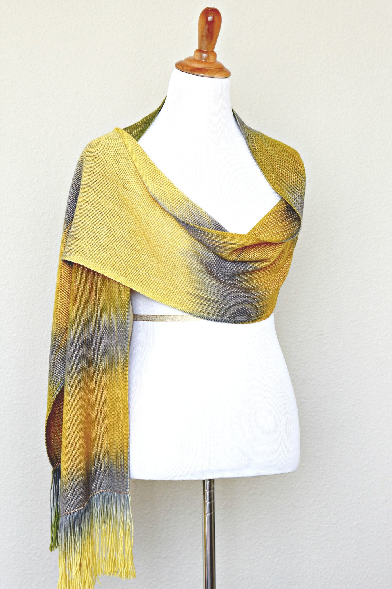 Woven scarf in mustard, green and grey colors