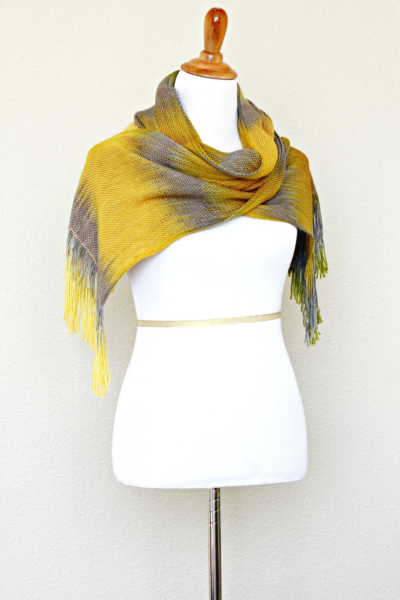Woven scarf in mustard, green and grey colors