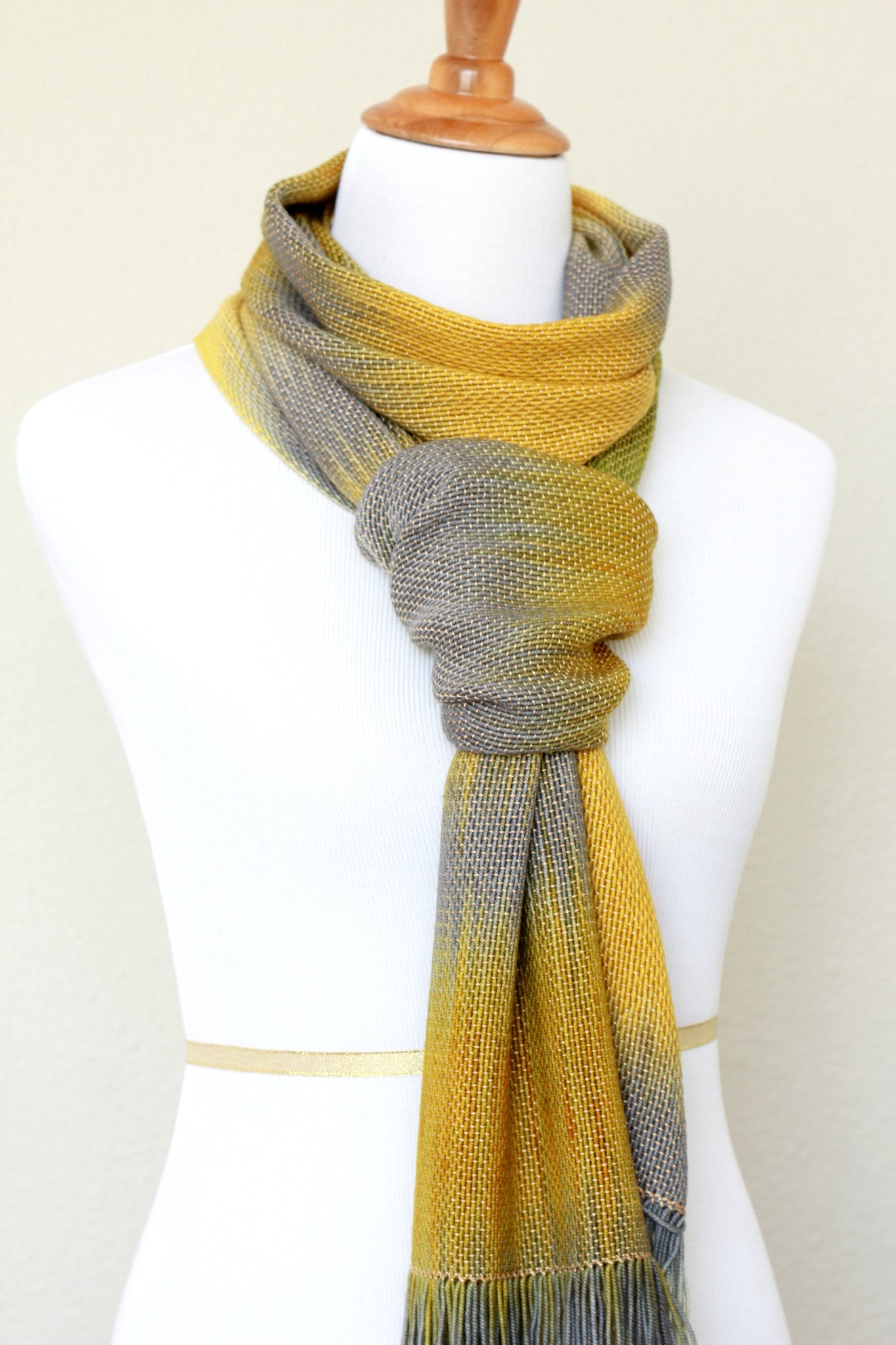 Woven scarf in mustard, green and grey colors