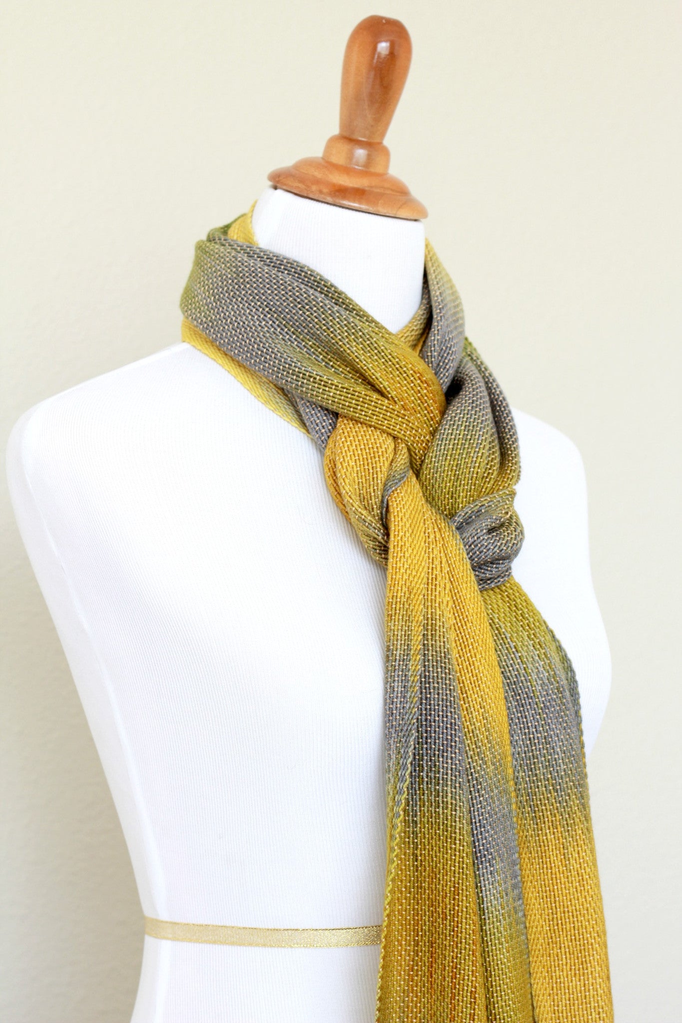 Woven scarf in mustard, green and grey colors