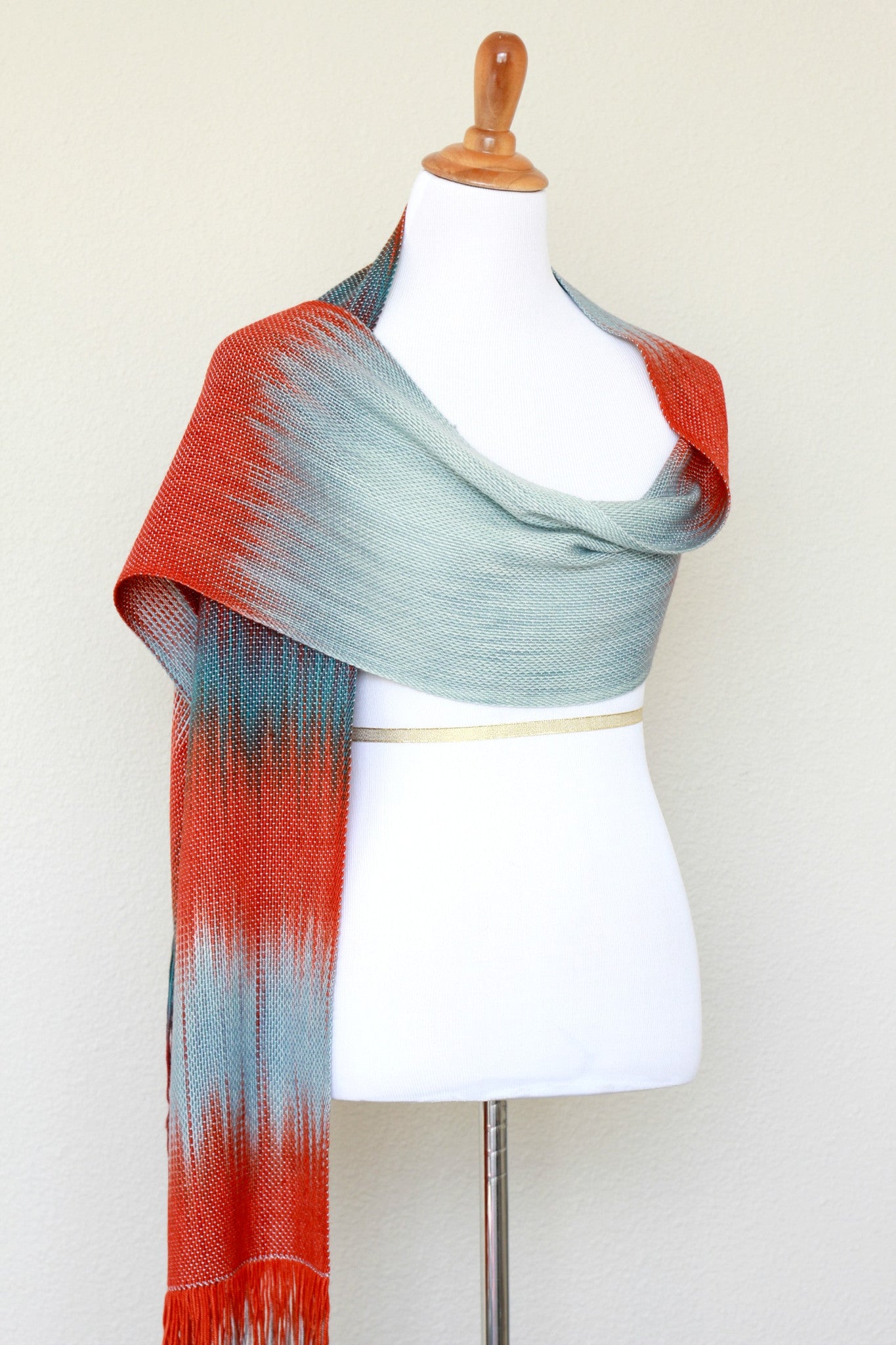 Woven scarf in blue grey, red and teal colors