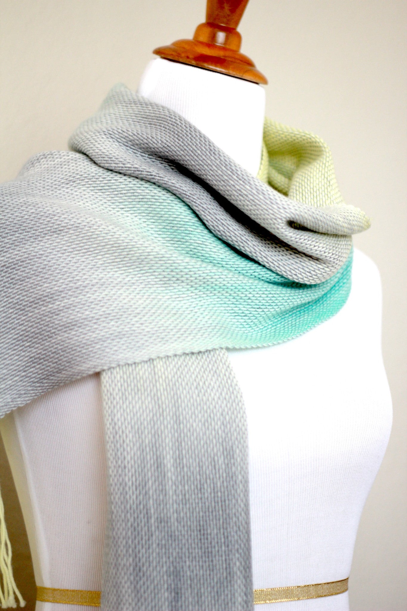 Woven scarf in yellow, green and grey colors