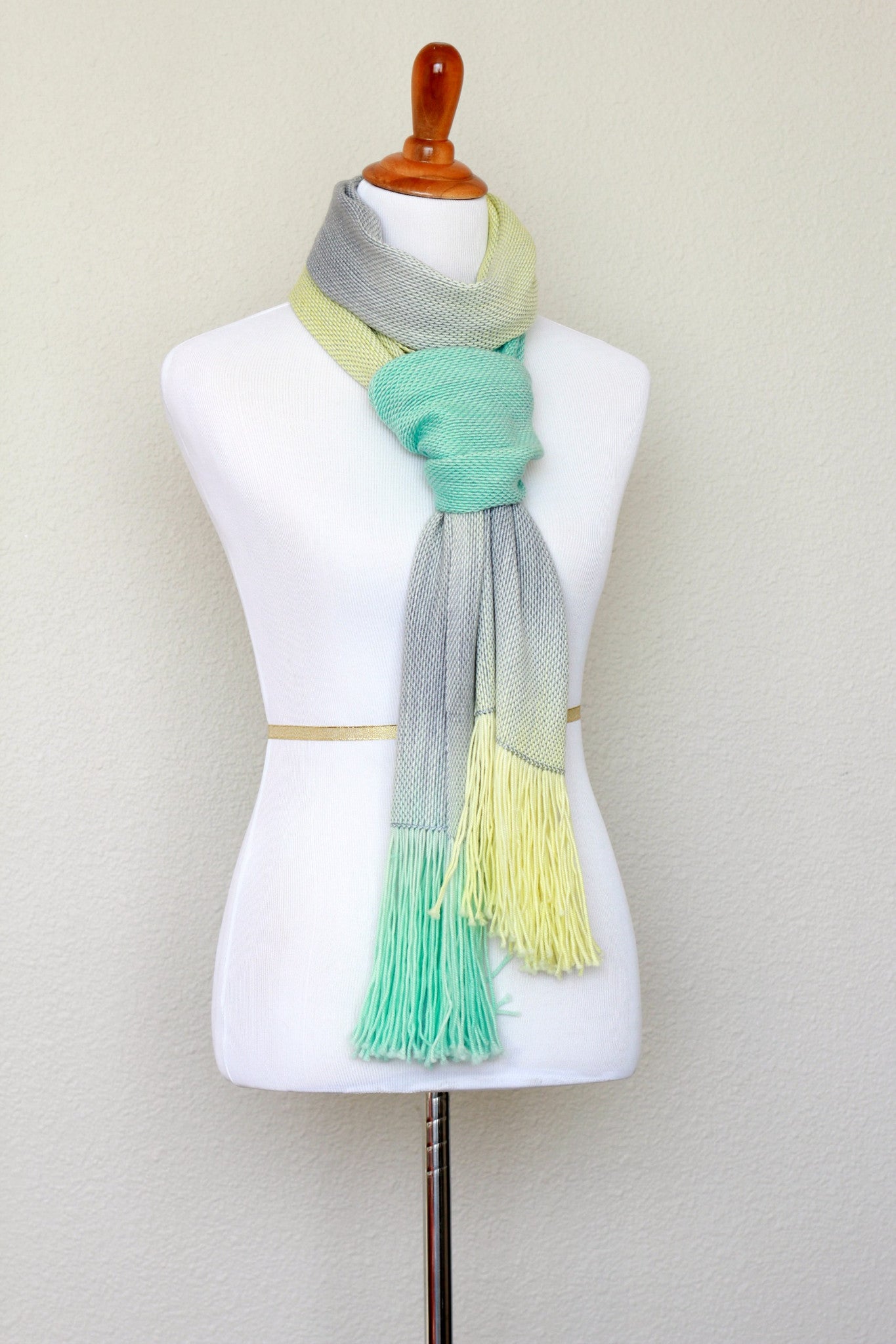 Woven scarf in yellow, green and grey colors