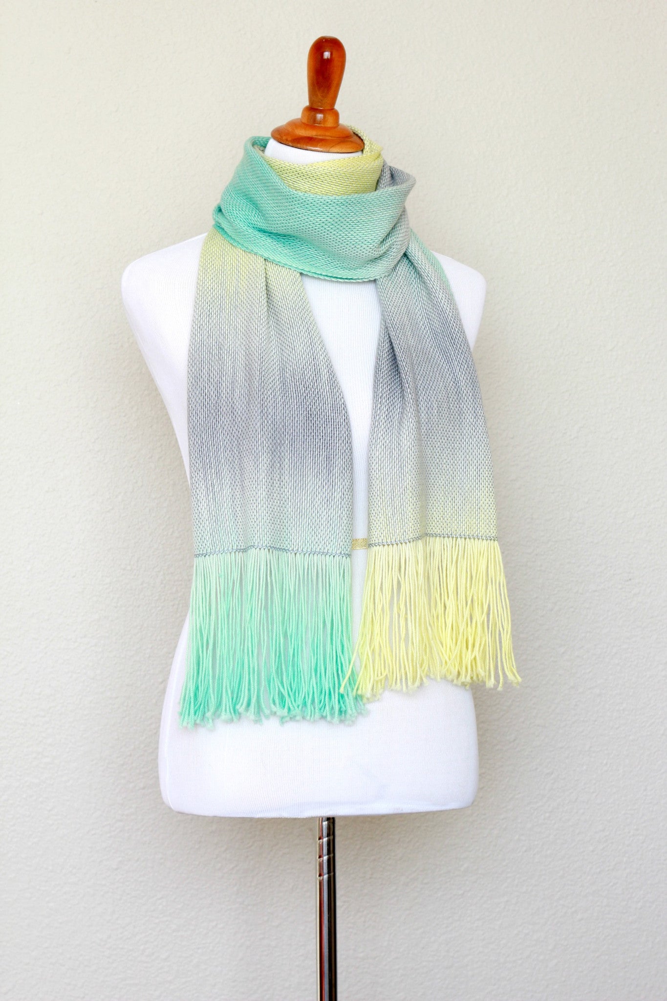 Woven scarf in yellow, green and grey colors