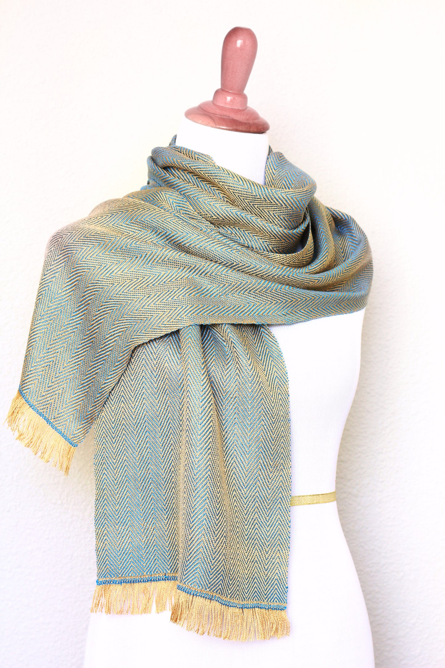 Woven scarf in gold and blue color with twill pattern, long scarf with fringe