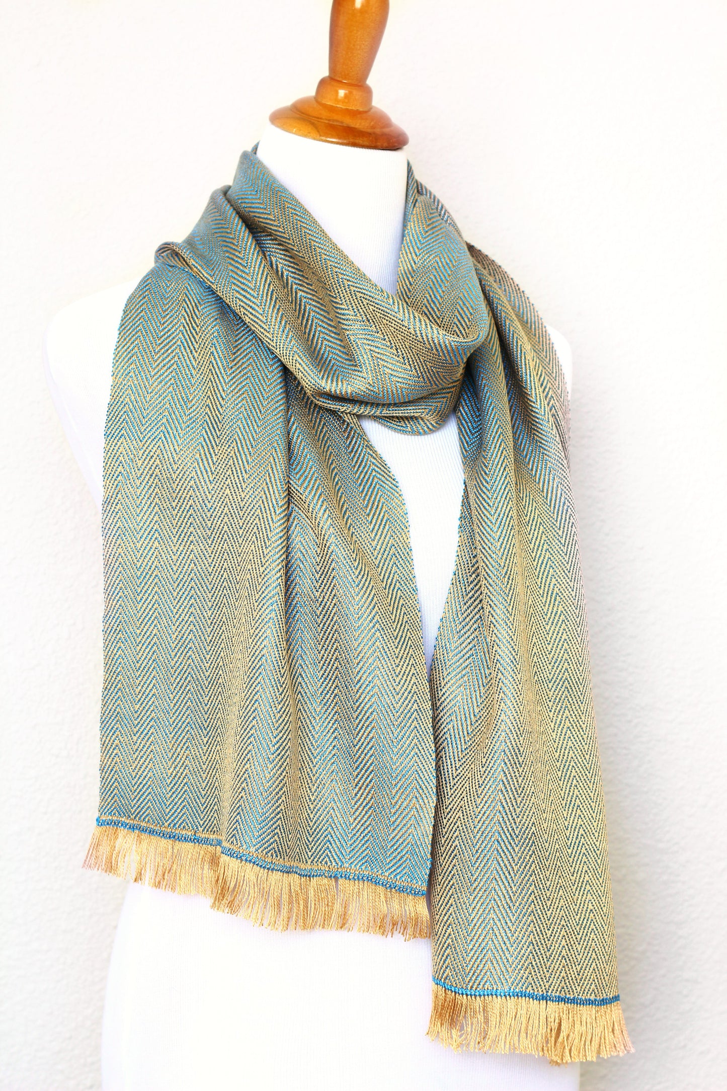 Woven scarf in gold and blue color with twill pattern, long scarf with fringe