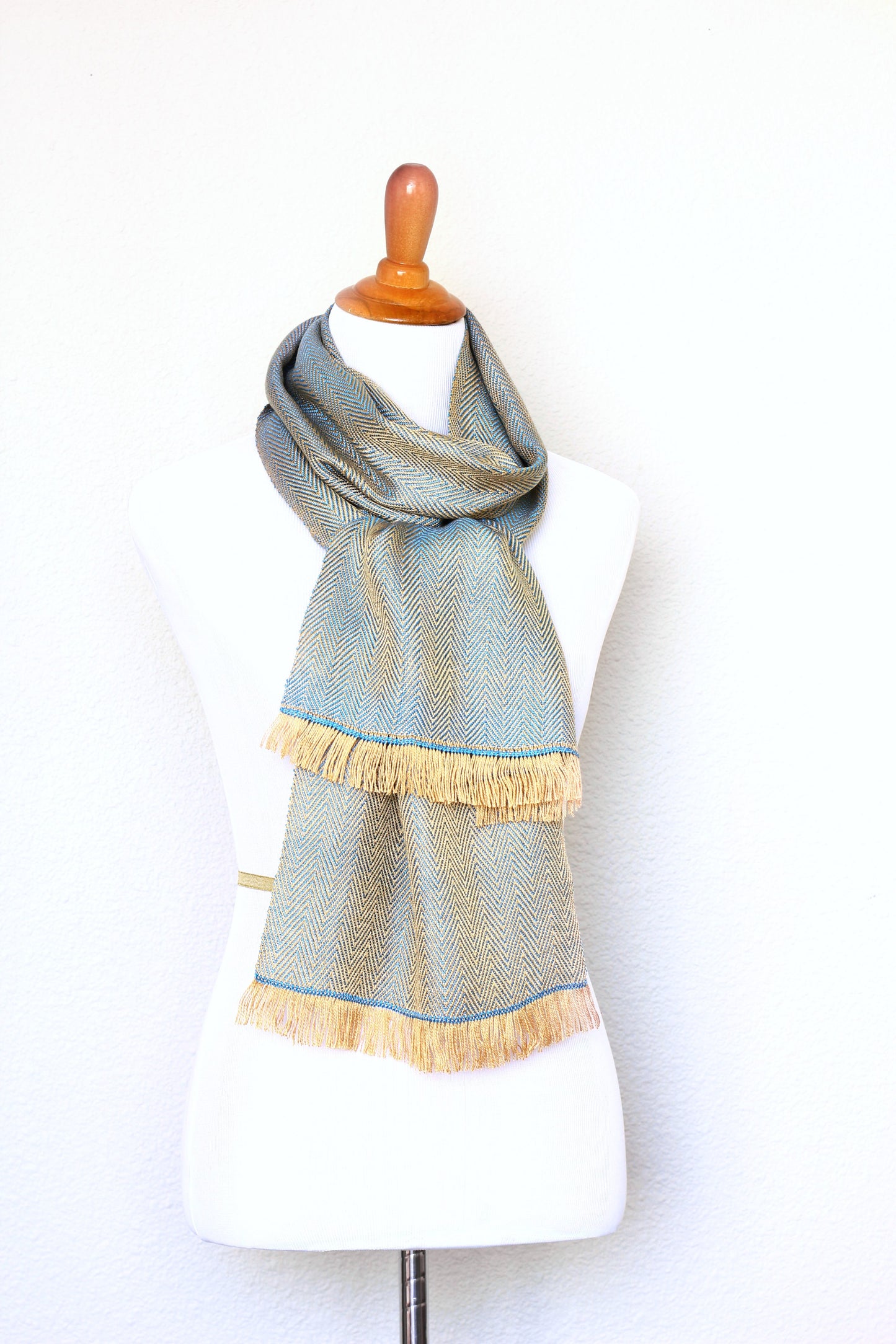 Woven scarf in gold and blue color with twill pattern, long scarf with fringe