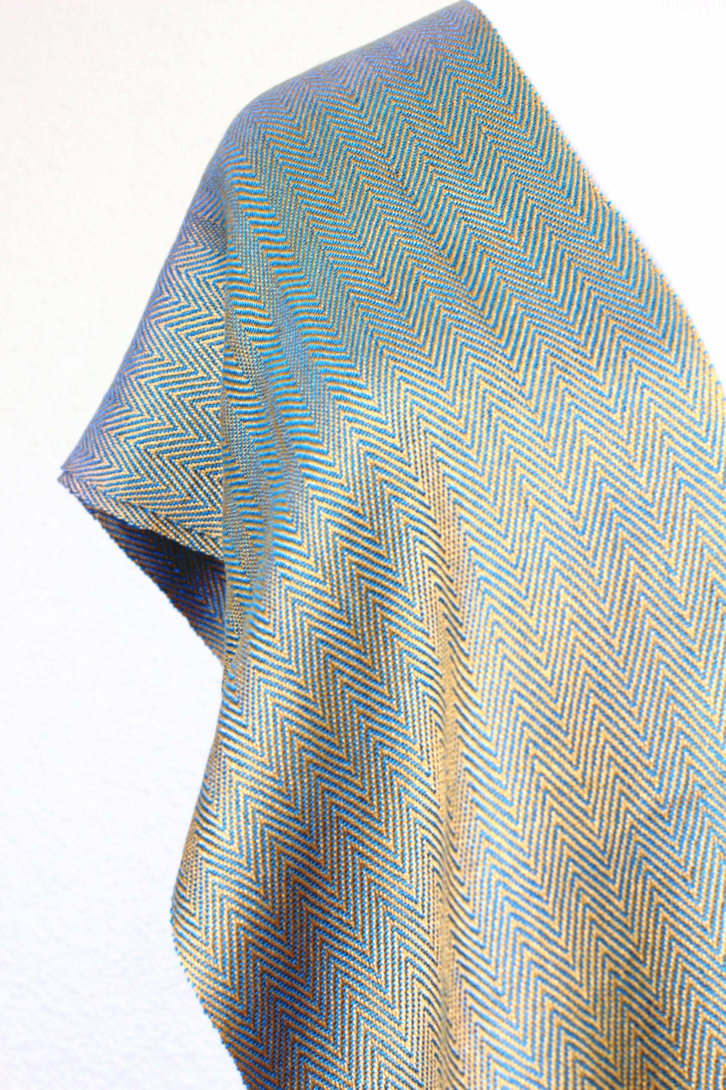 Woven scarf in gold and blue color with twill pattern, long scarf with fringe