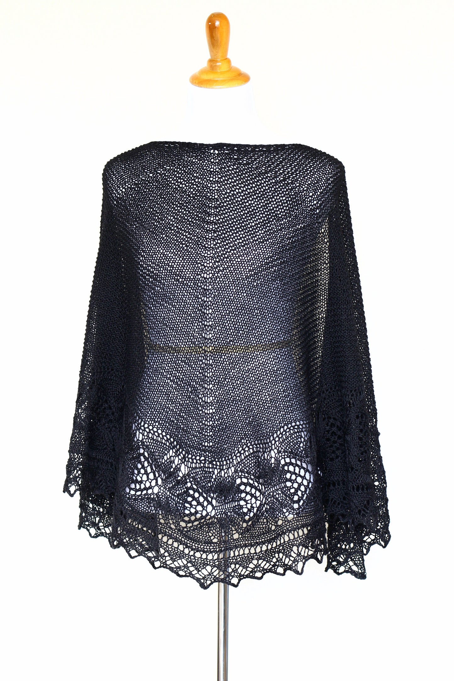 Knit shawl with laced border in black color