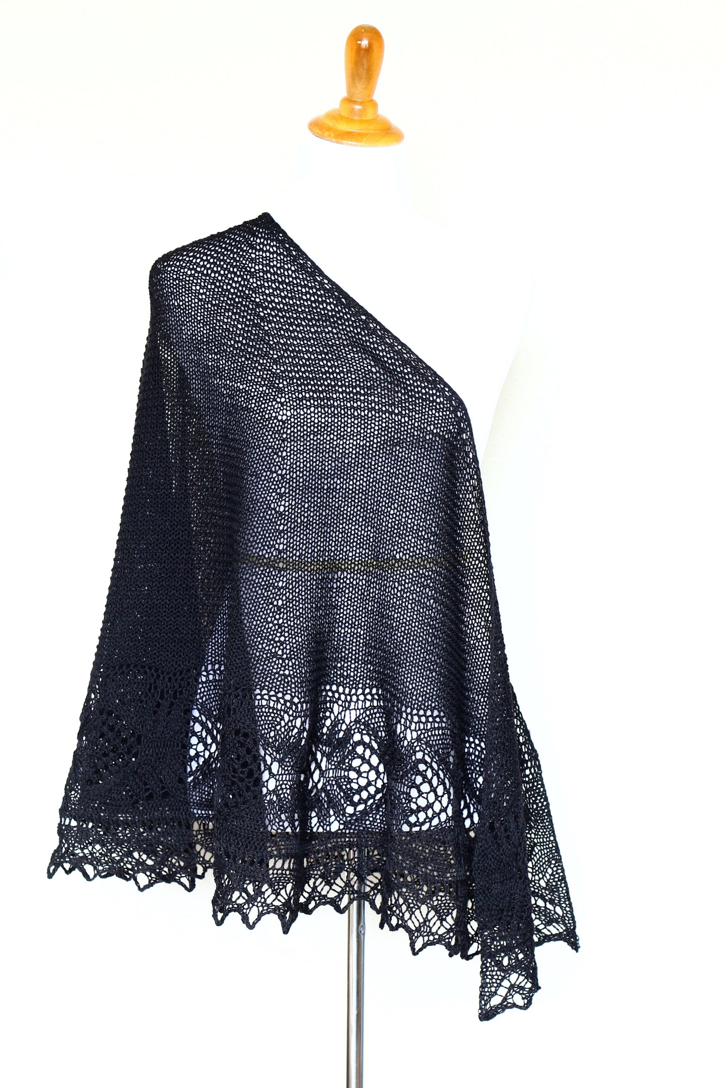 Knit shawl with laced border in black color