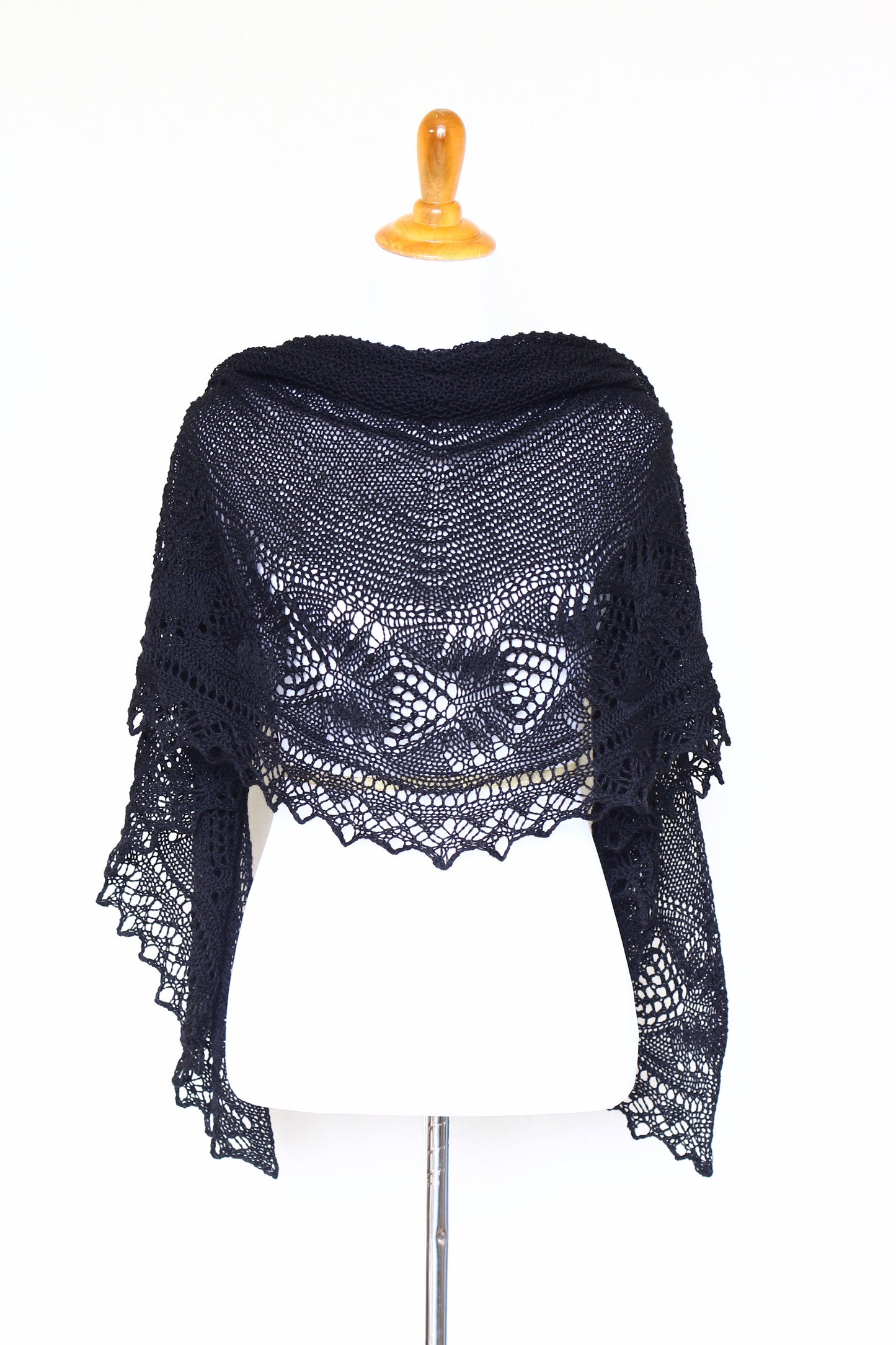 Knit shawl with laced border in black color