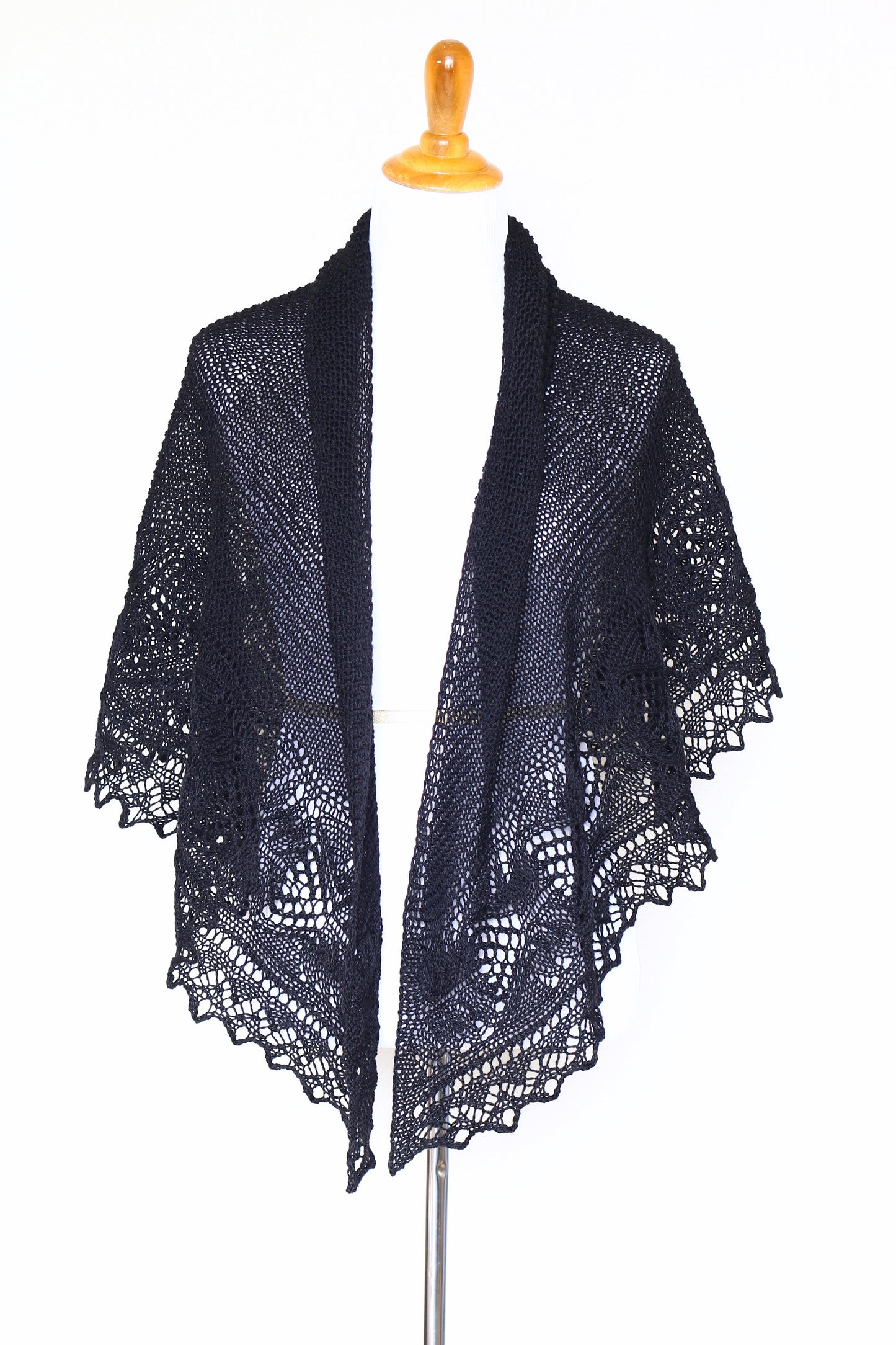 Knit shawl with laced border in black color