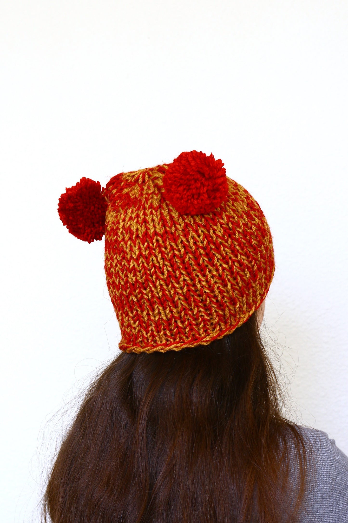 Knit hat with two poms, knit skull hat in red orange color