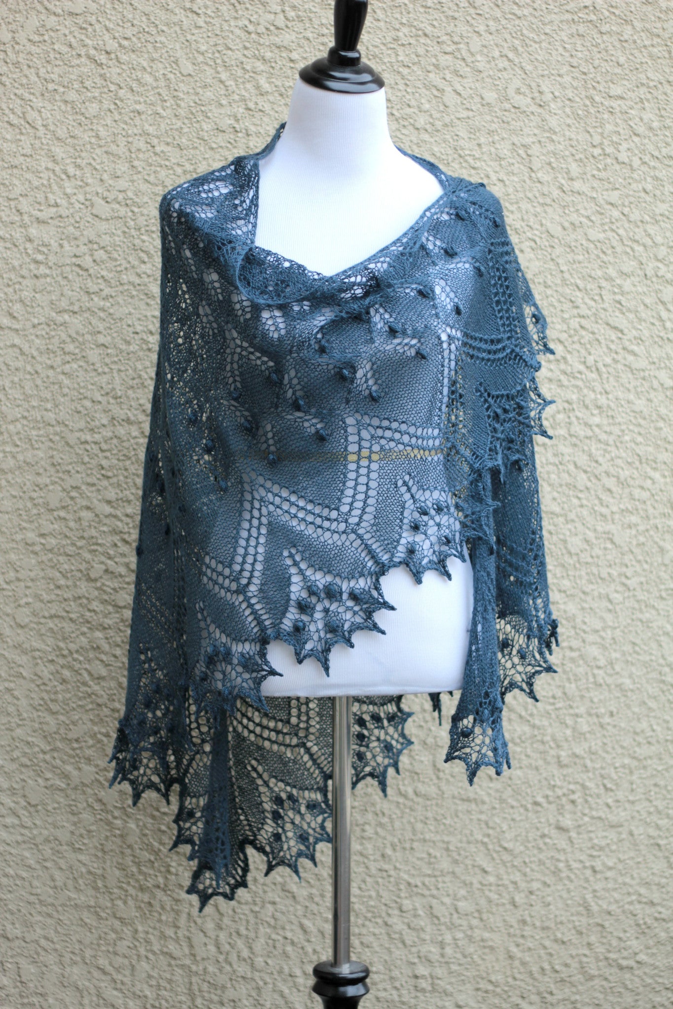 Knit lace shawl in grey blue color with nupps