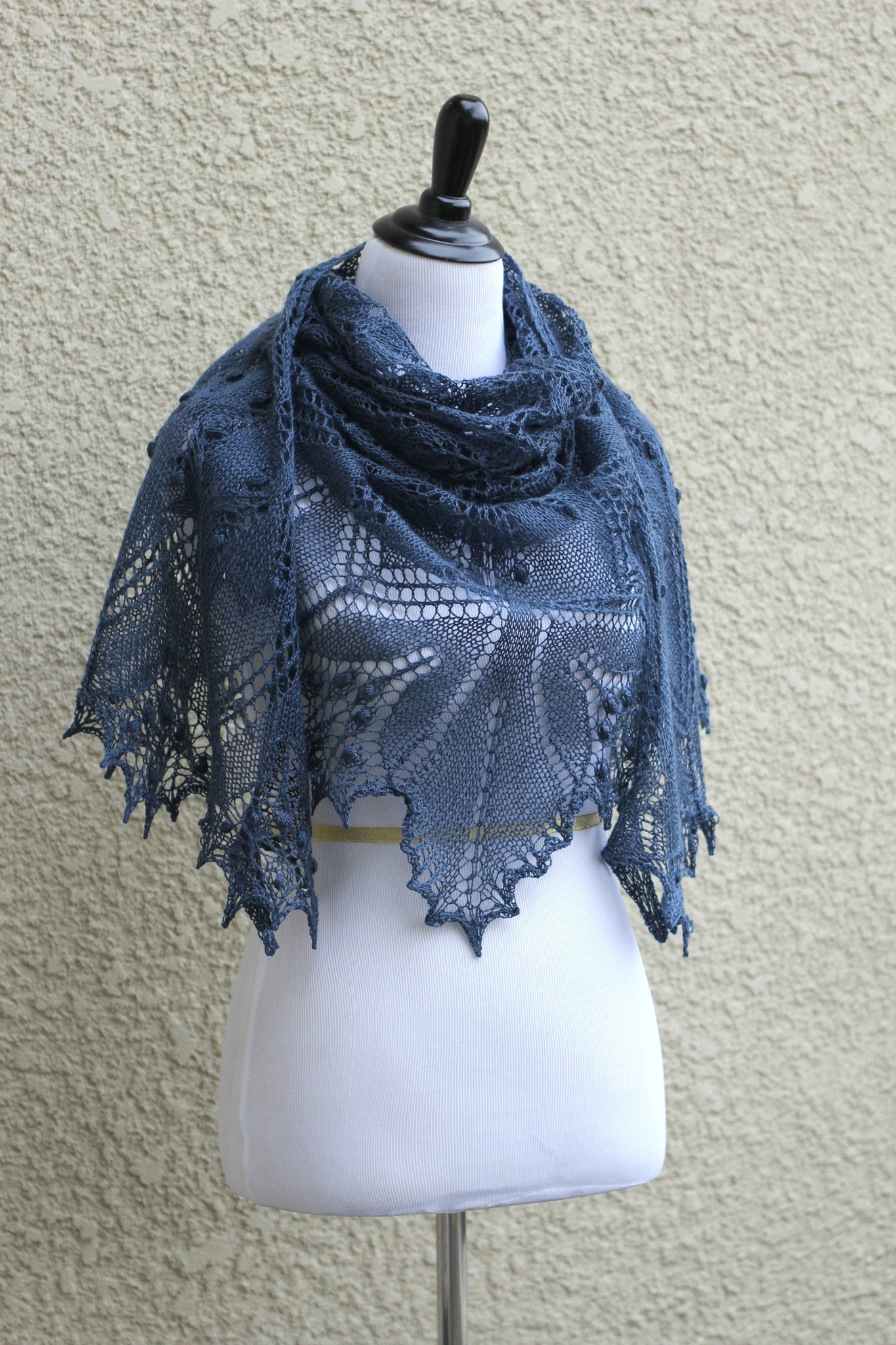 Knit lace shawl in grey blue color with nupps