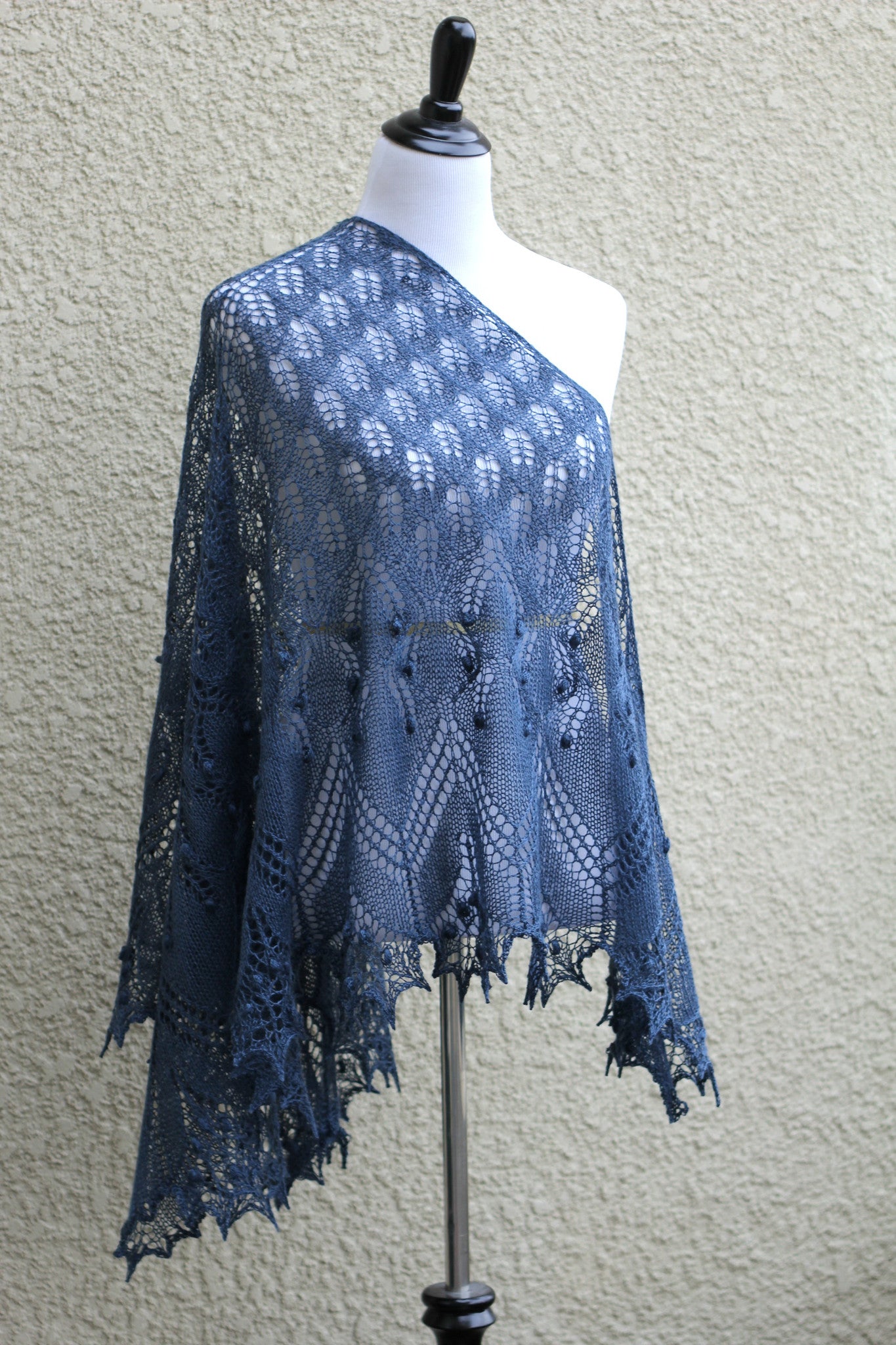 Knit lace shawl in grey blue color with nupps