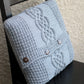 Knit cable pillow case with cable in grey color