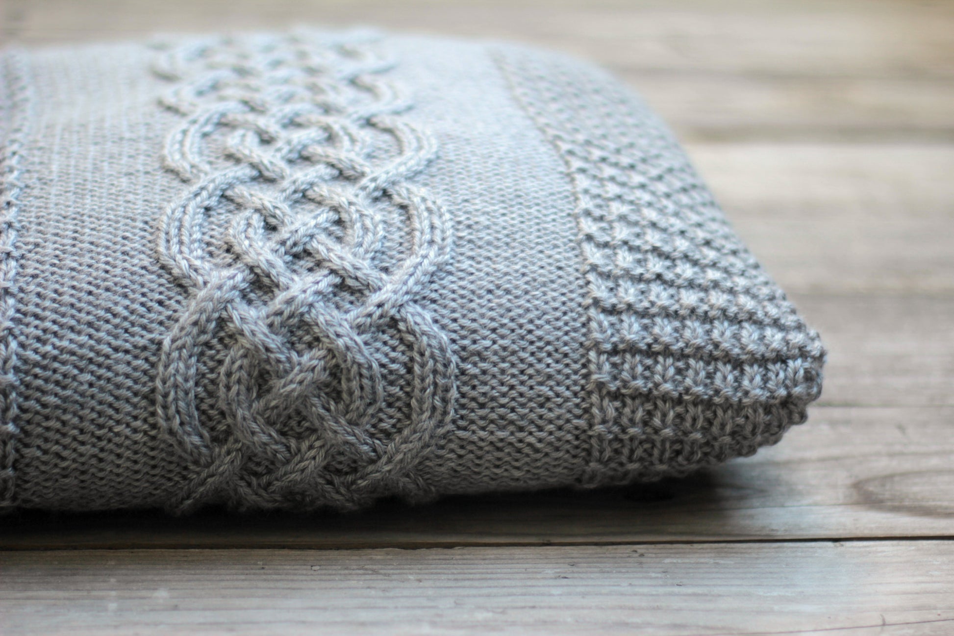 Knit cabled pillow