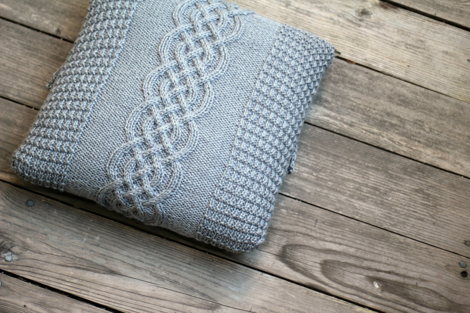 Knit cabled pillow