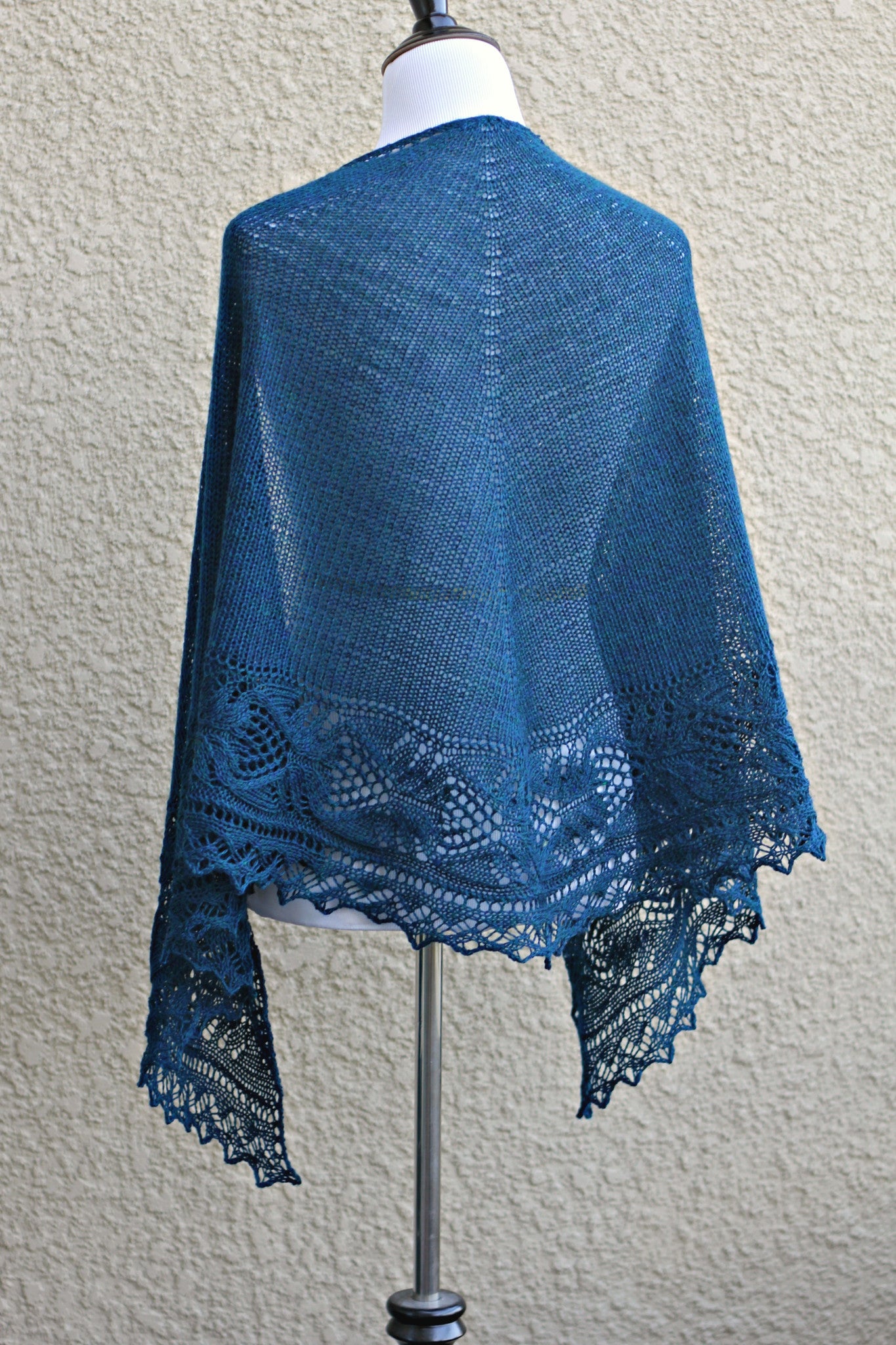 Knit shawl with lace border