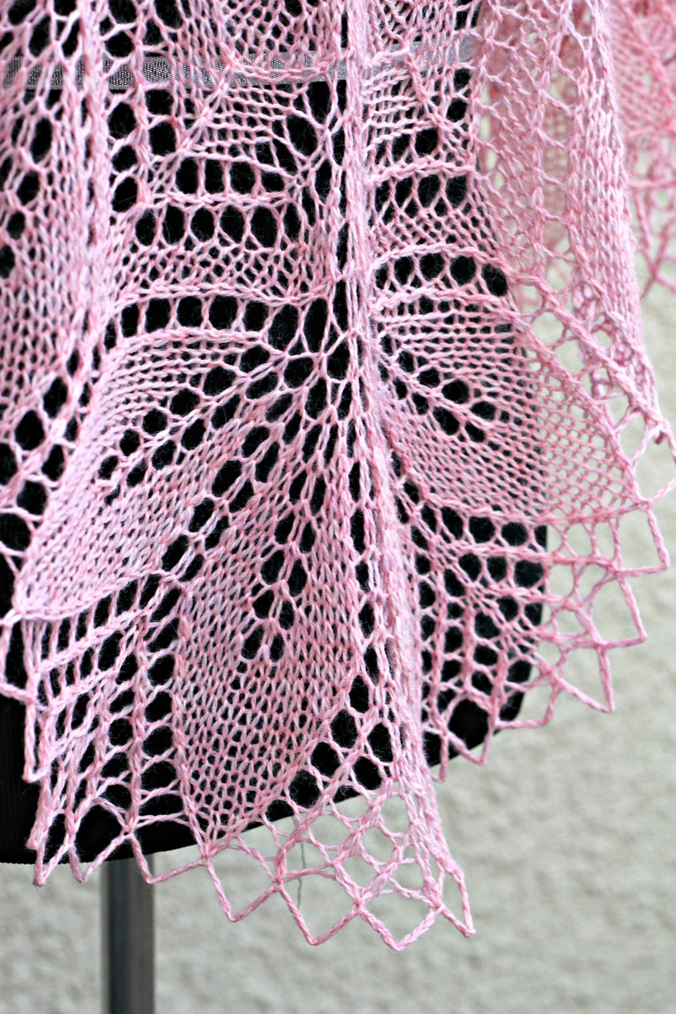 Knitted shawl in pink color