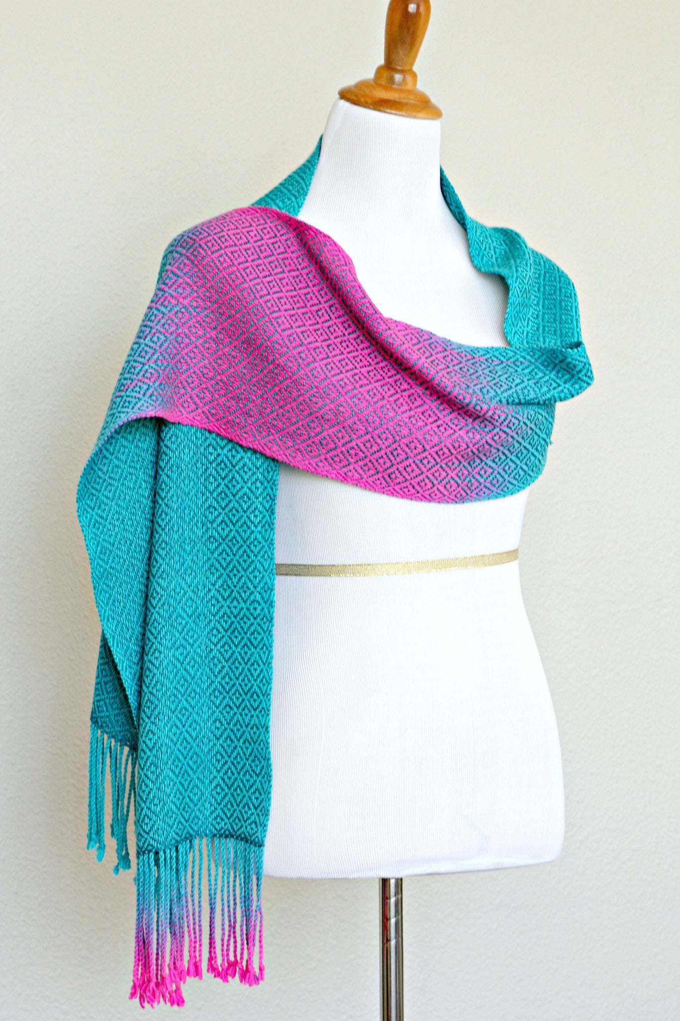 Woven scarf in blue and neon pink with woven pattern and twisted fringe