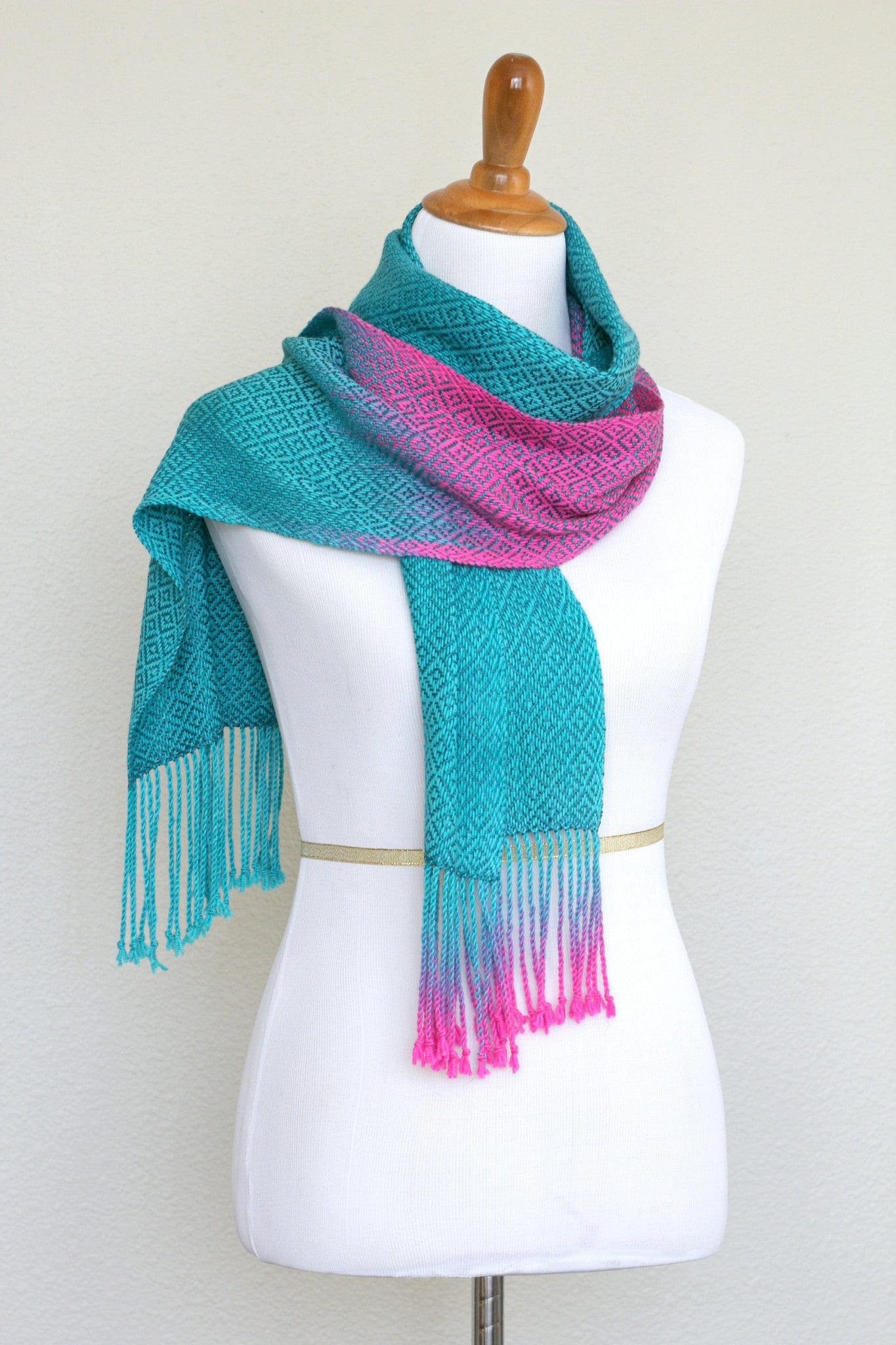 Woven scarf in blue and neon pink with woven pattern and twisted fringe