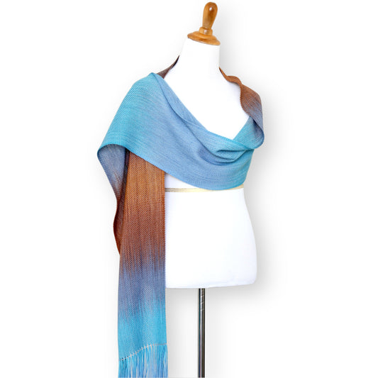 Woven scarf in turquoise, blue and brown colors