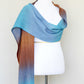 Woven scarf in turquoise, blue and brown colors