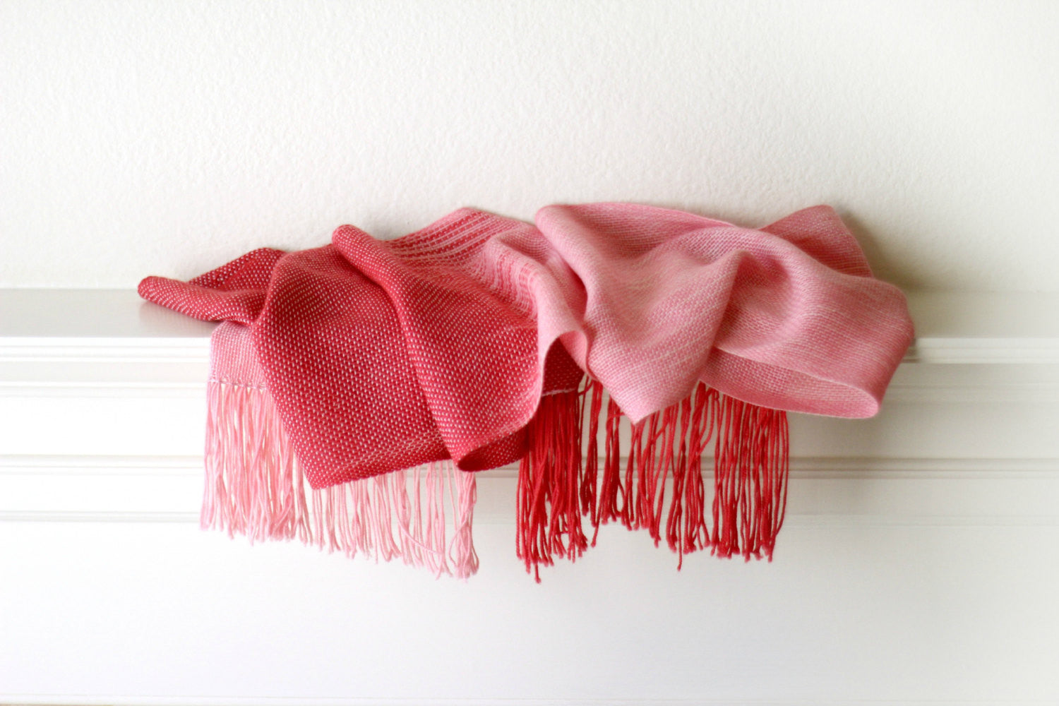 Hand woven scarf in red and pink shades