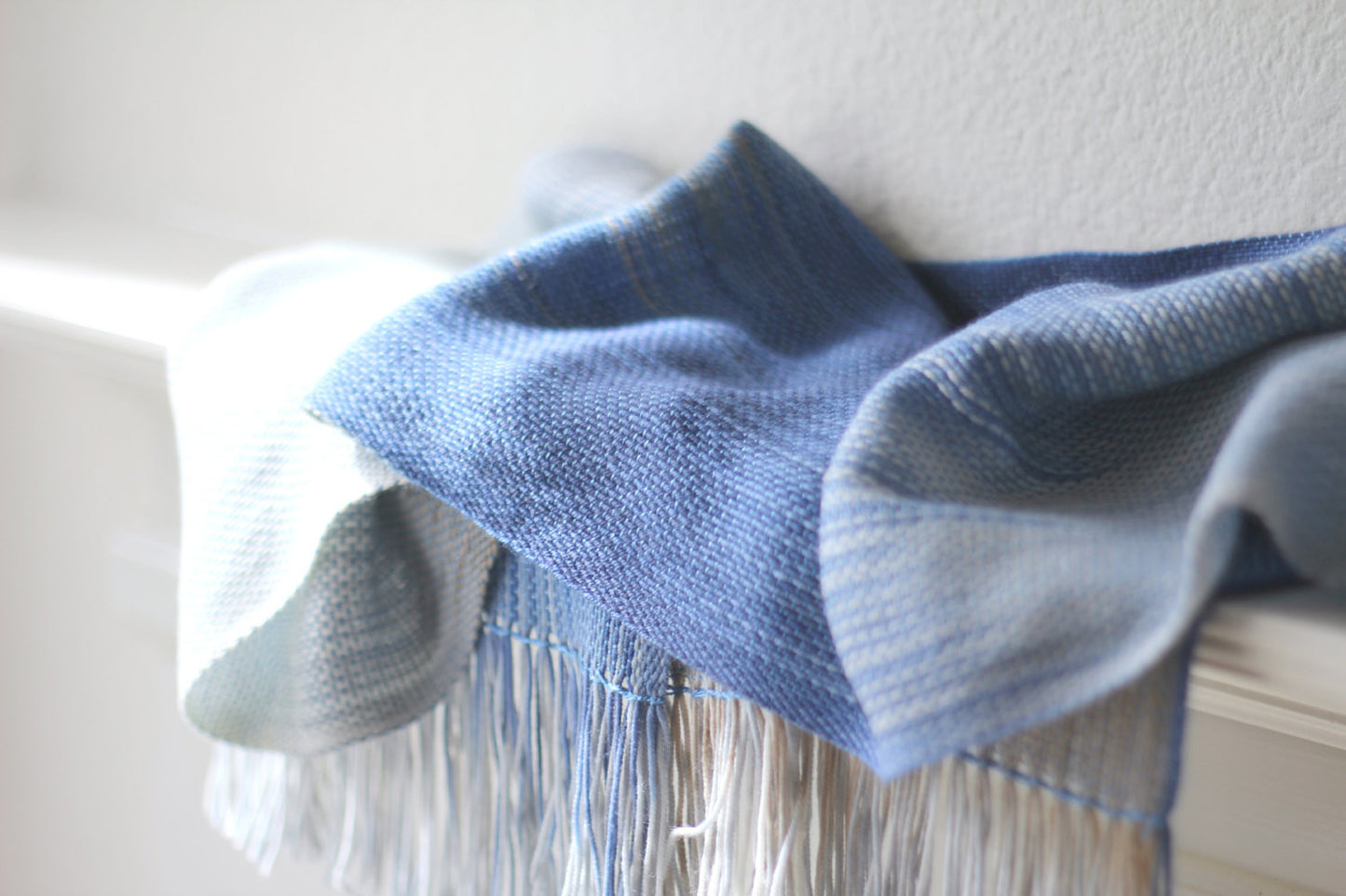 Blue and white woven scarf