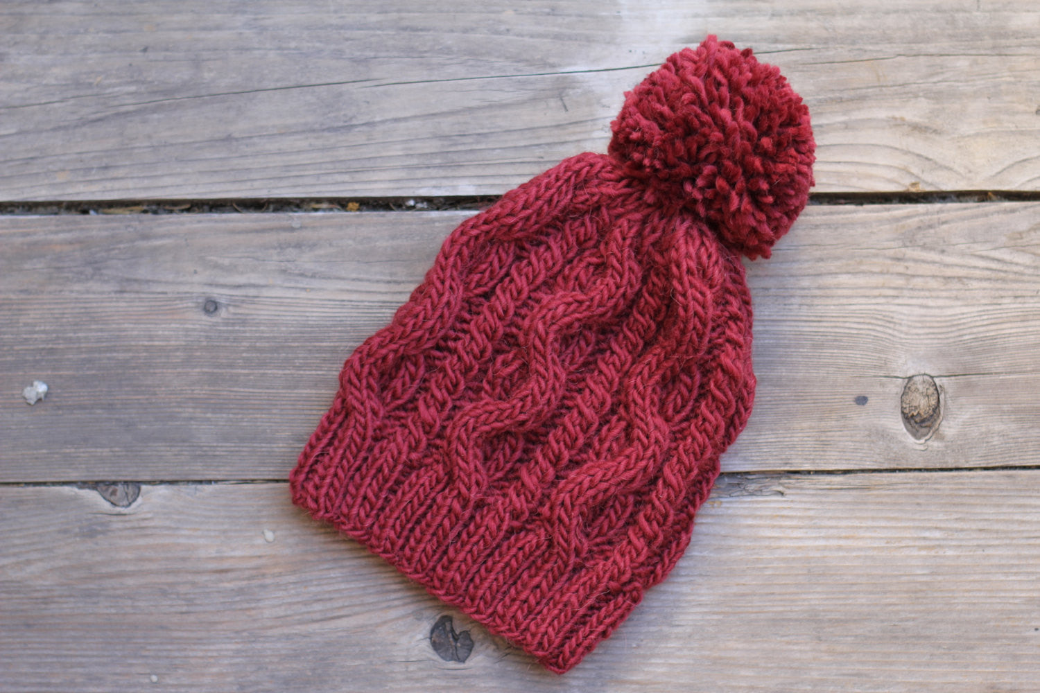 Knitted hat with cables