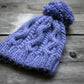 Knitted cabled hat